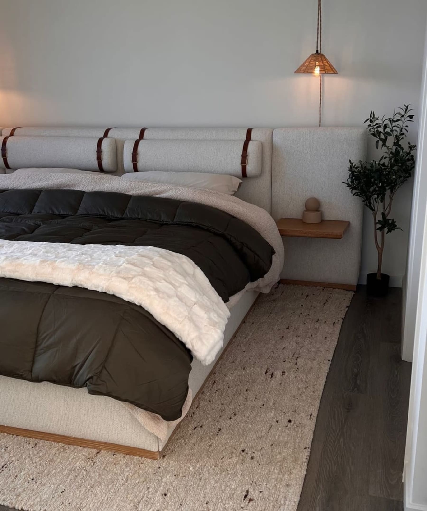 A headboard with floating nightstands and headrests.