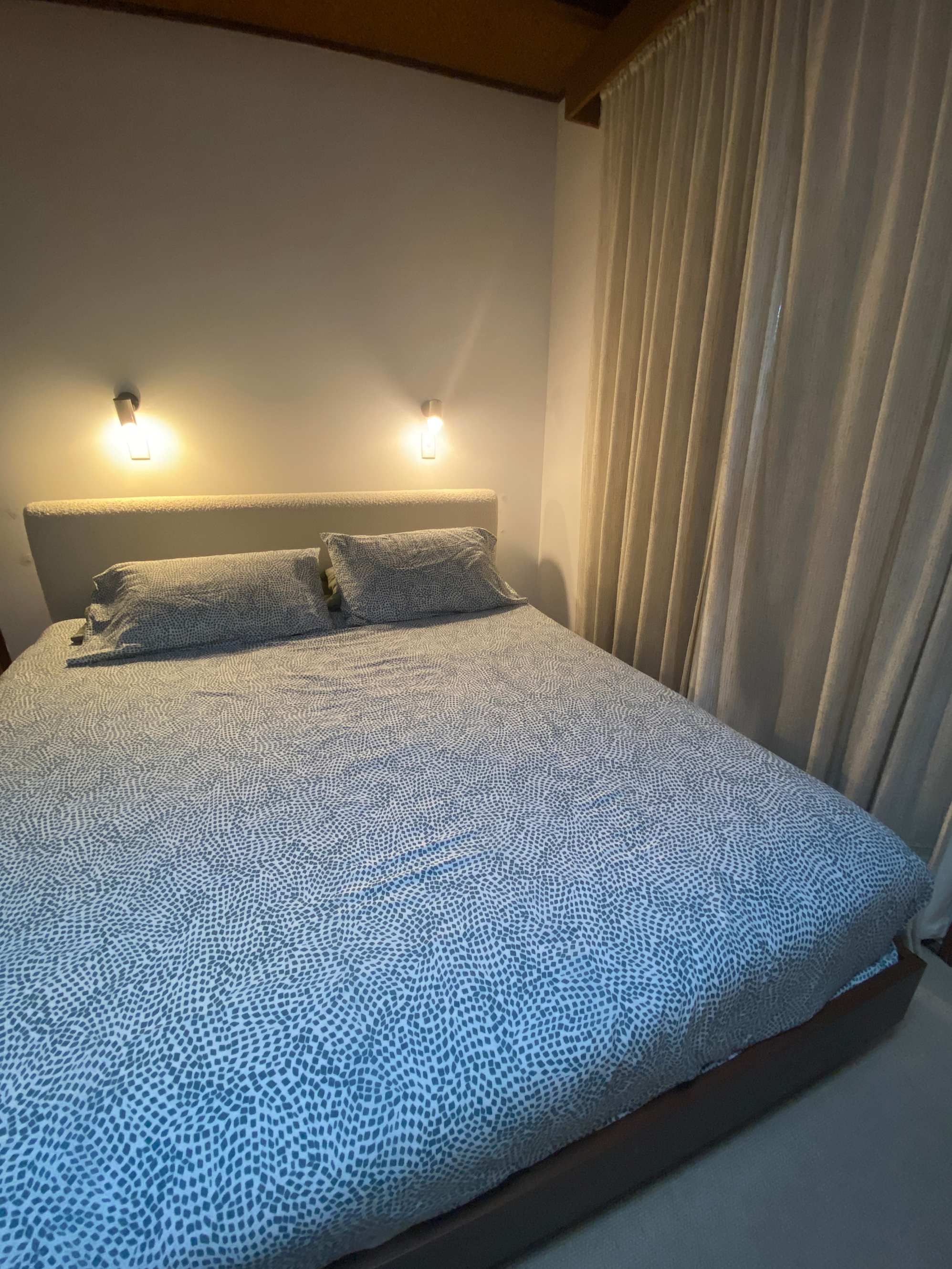 Solid bed with comfy bedhead