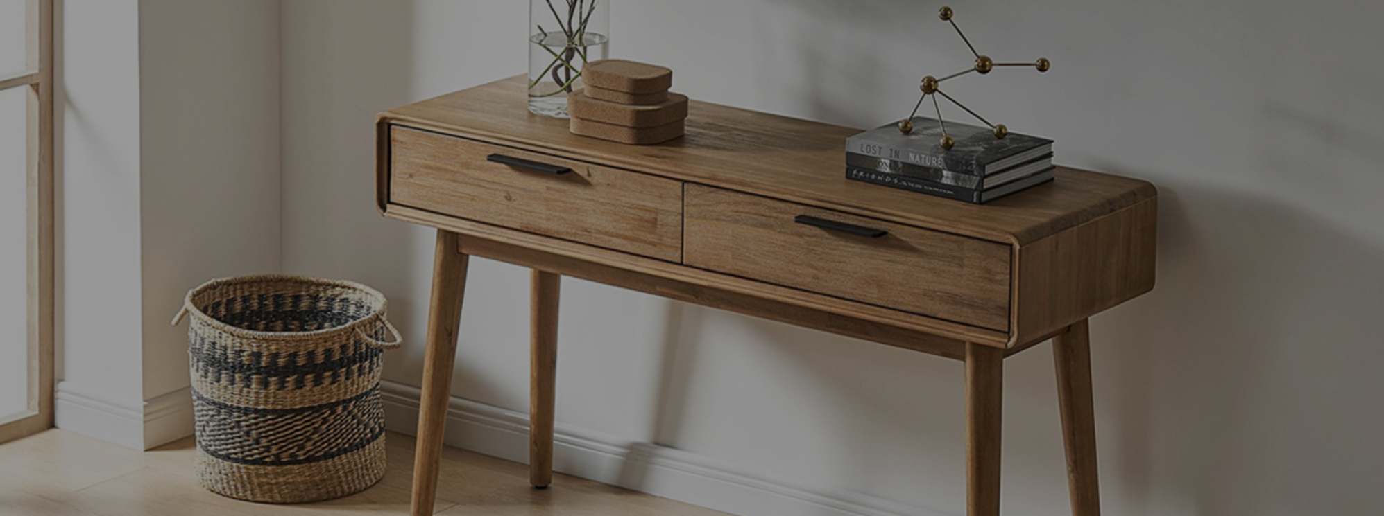 An acacia wood console table.
