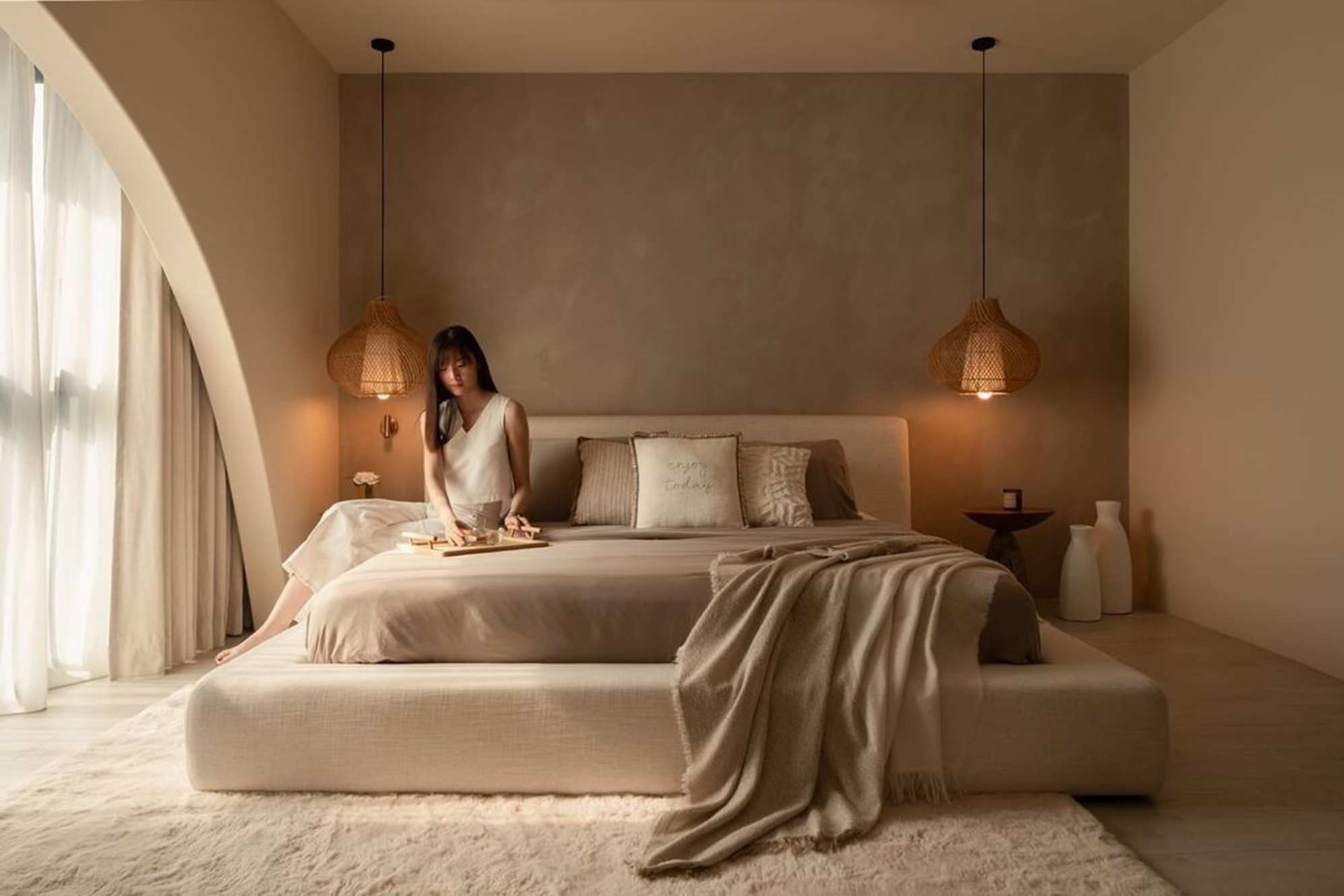 A person sitting on a bed.