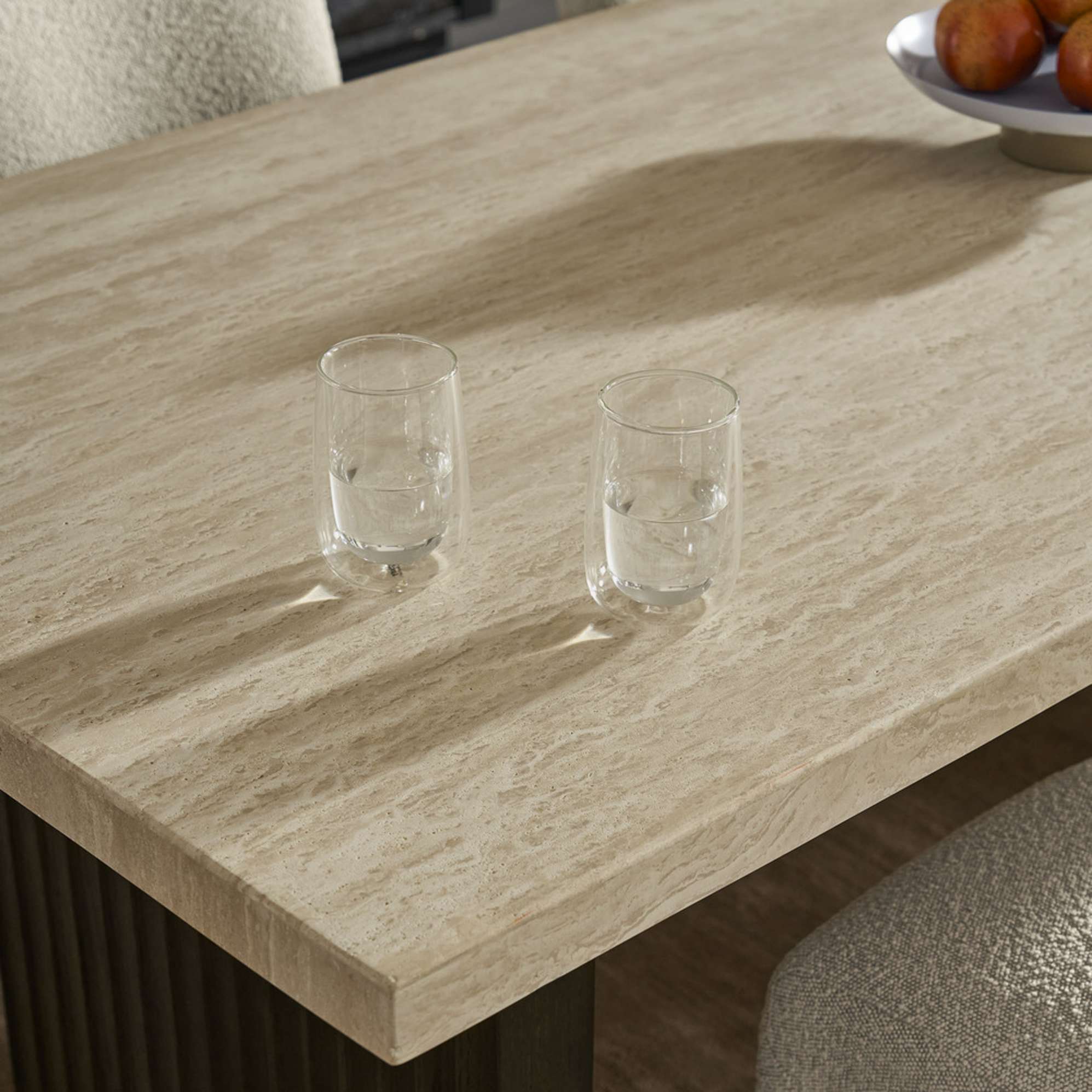 A close-up of a travertine tabletop.