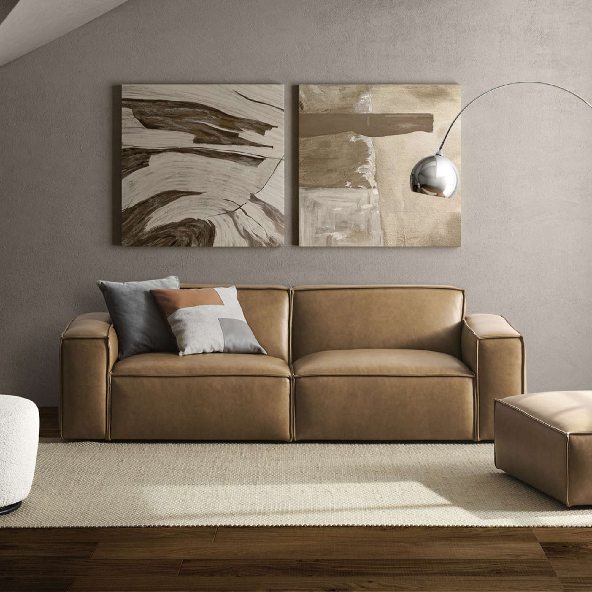 A leather 3 seater sofa placed against a wall on an area rug.