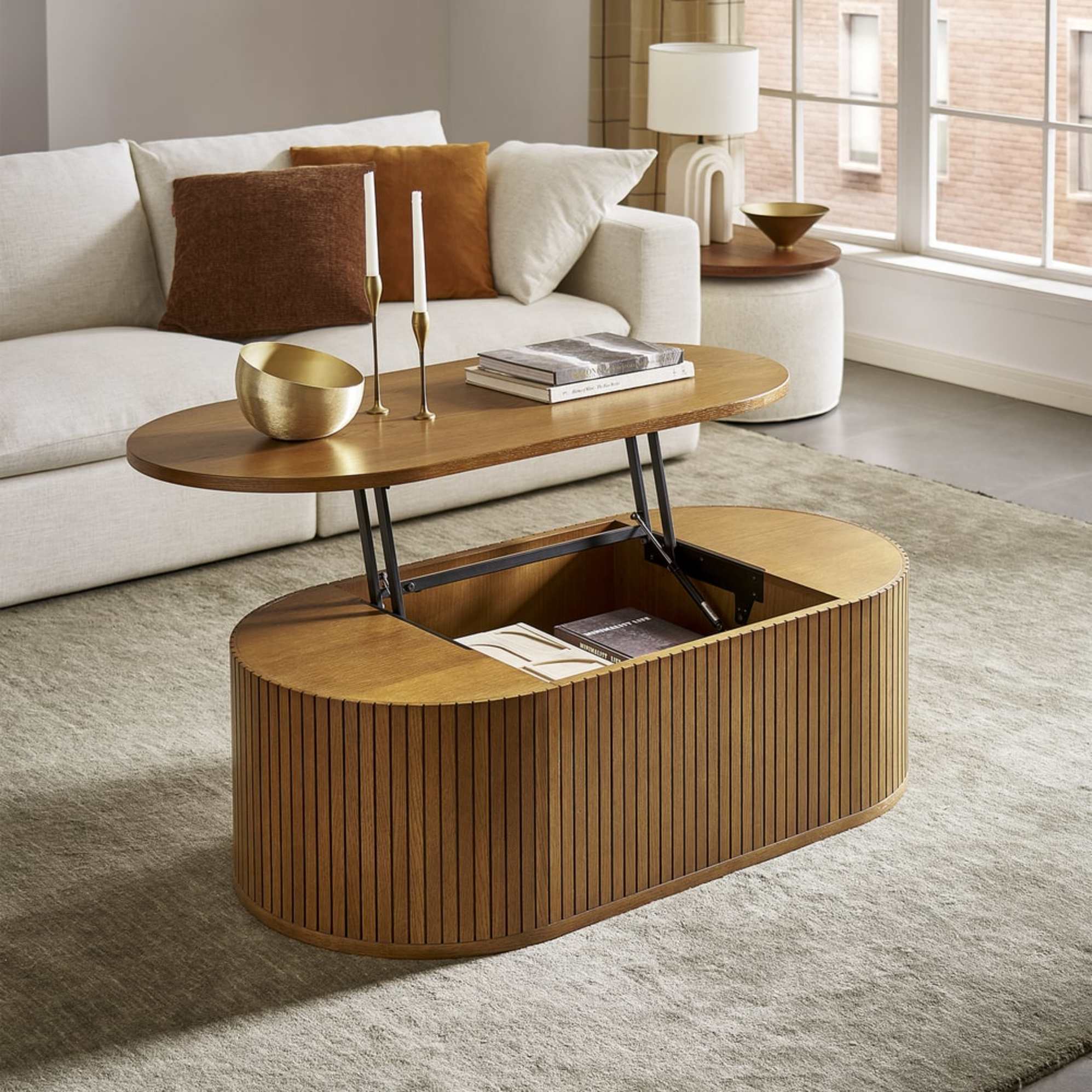 A coffee table with tambour details and a lift-top section that reveals concealed storage.