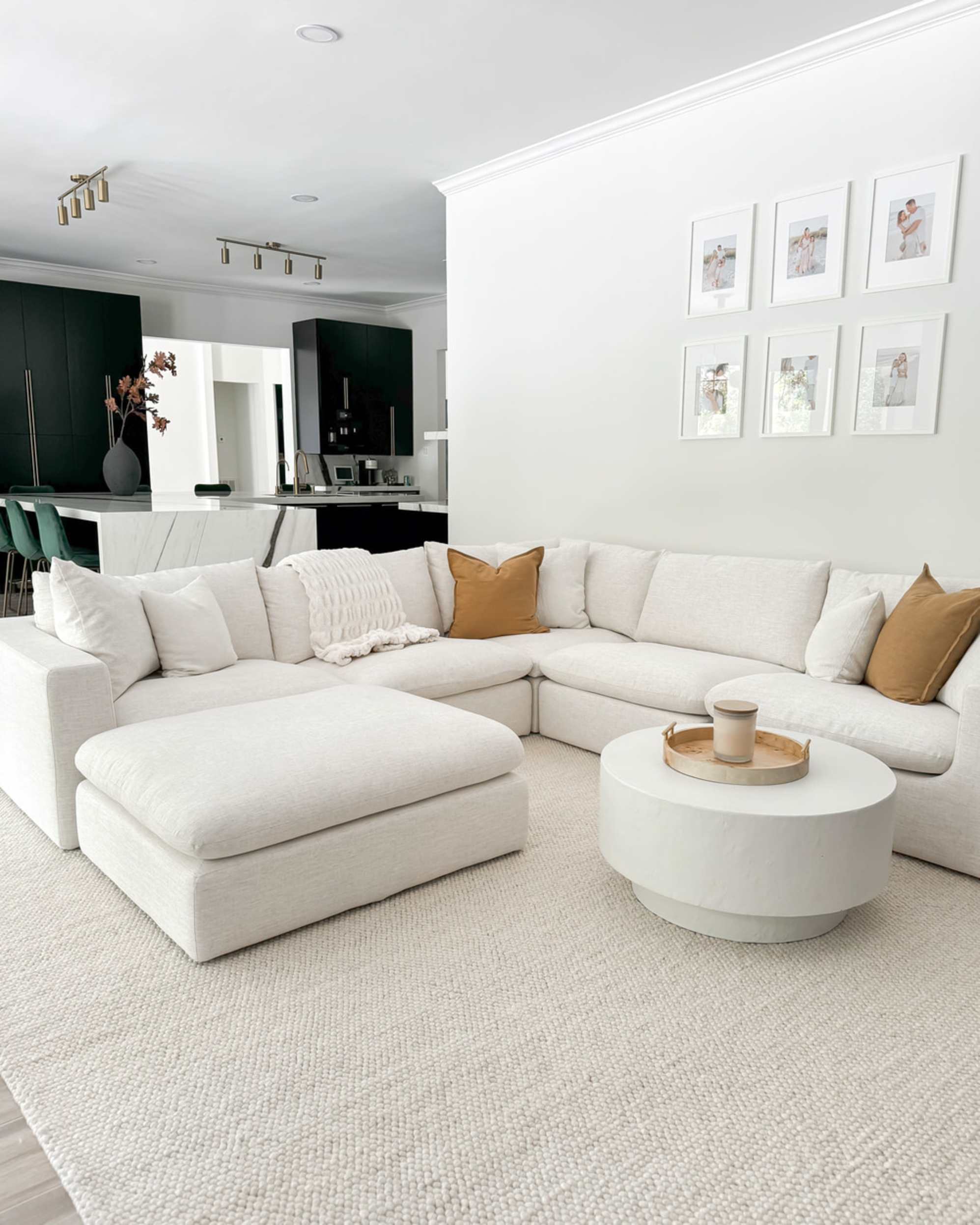 An l-shaped sectional sofa with a matching ottoman placed at the end.