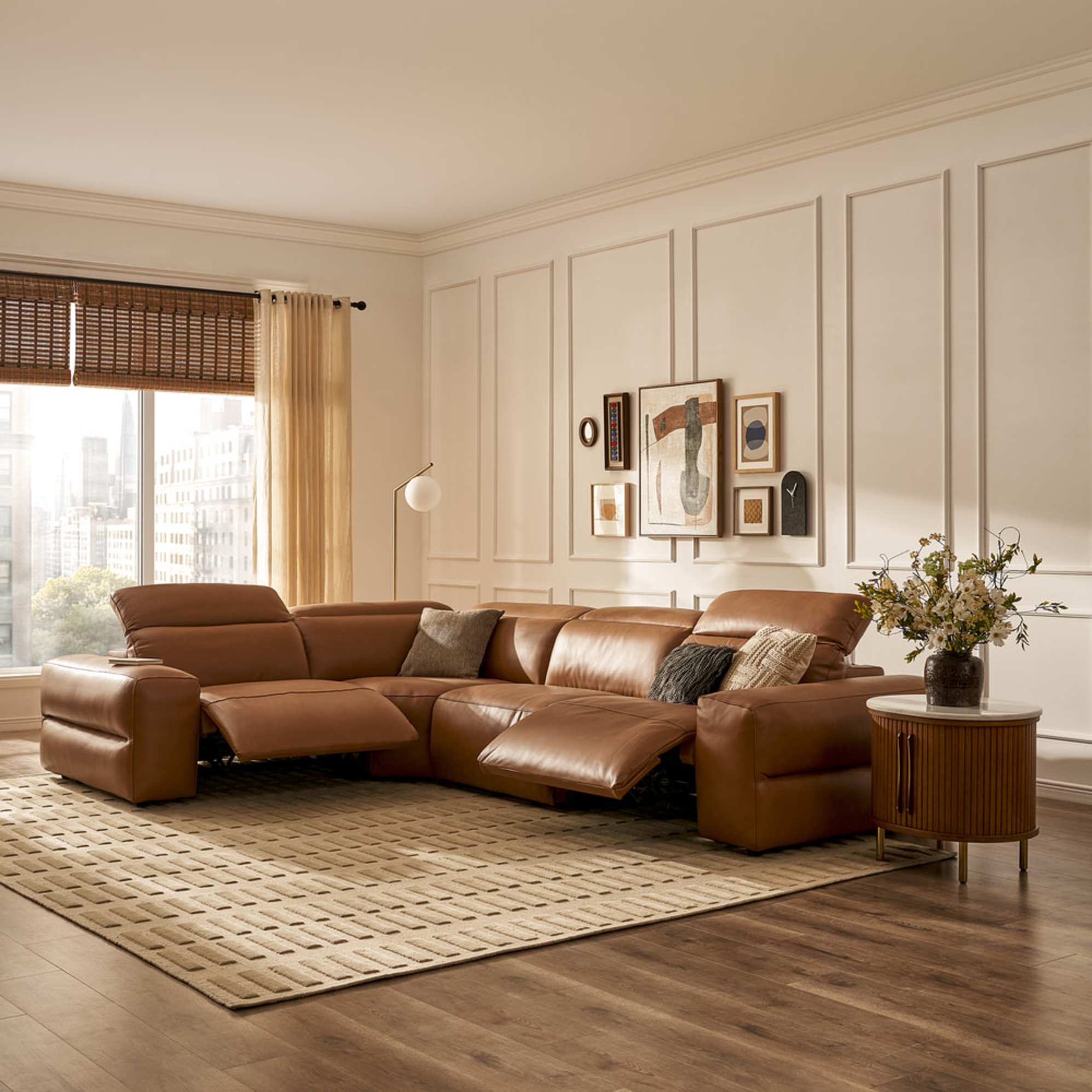 A leather chaise sectional recliner sofa in a living room.