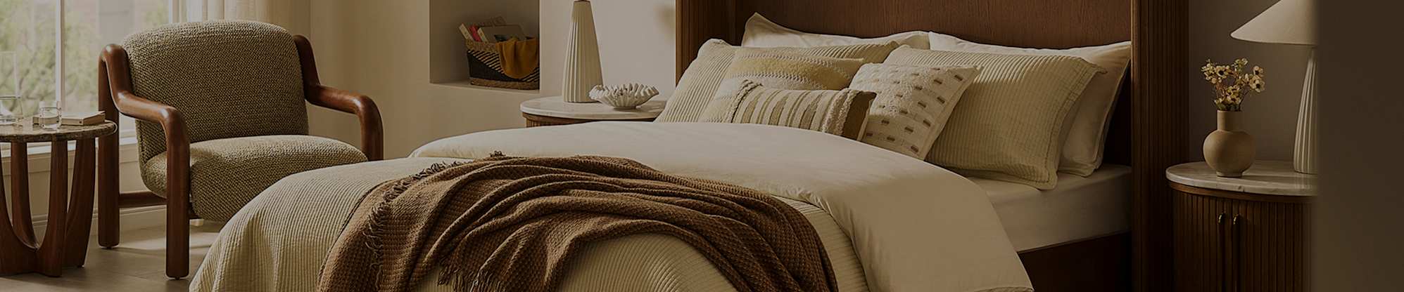 A bed with a wooden wingback headboard placed in a bedroom.