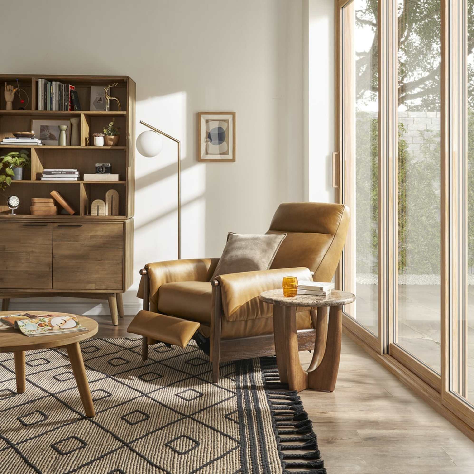 A leather recliner armchair and a marble side table.