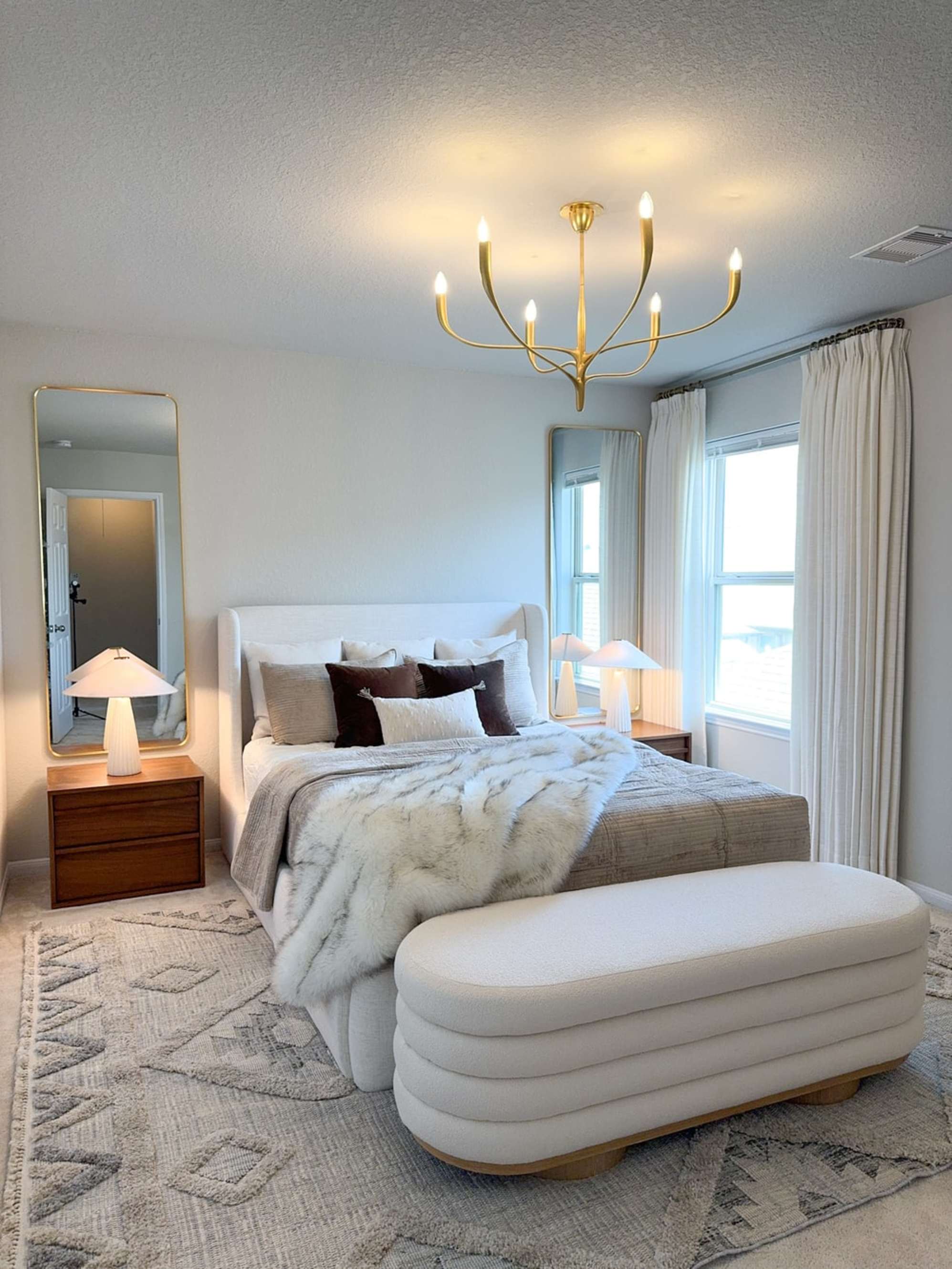 A storage bench placed at the foot of a bed.