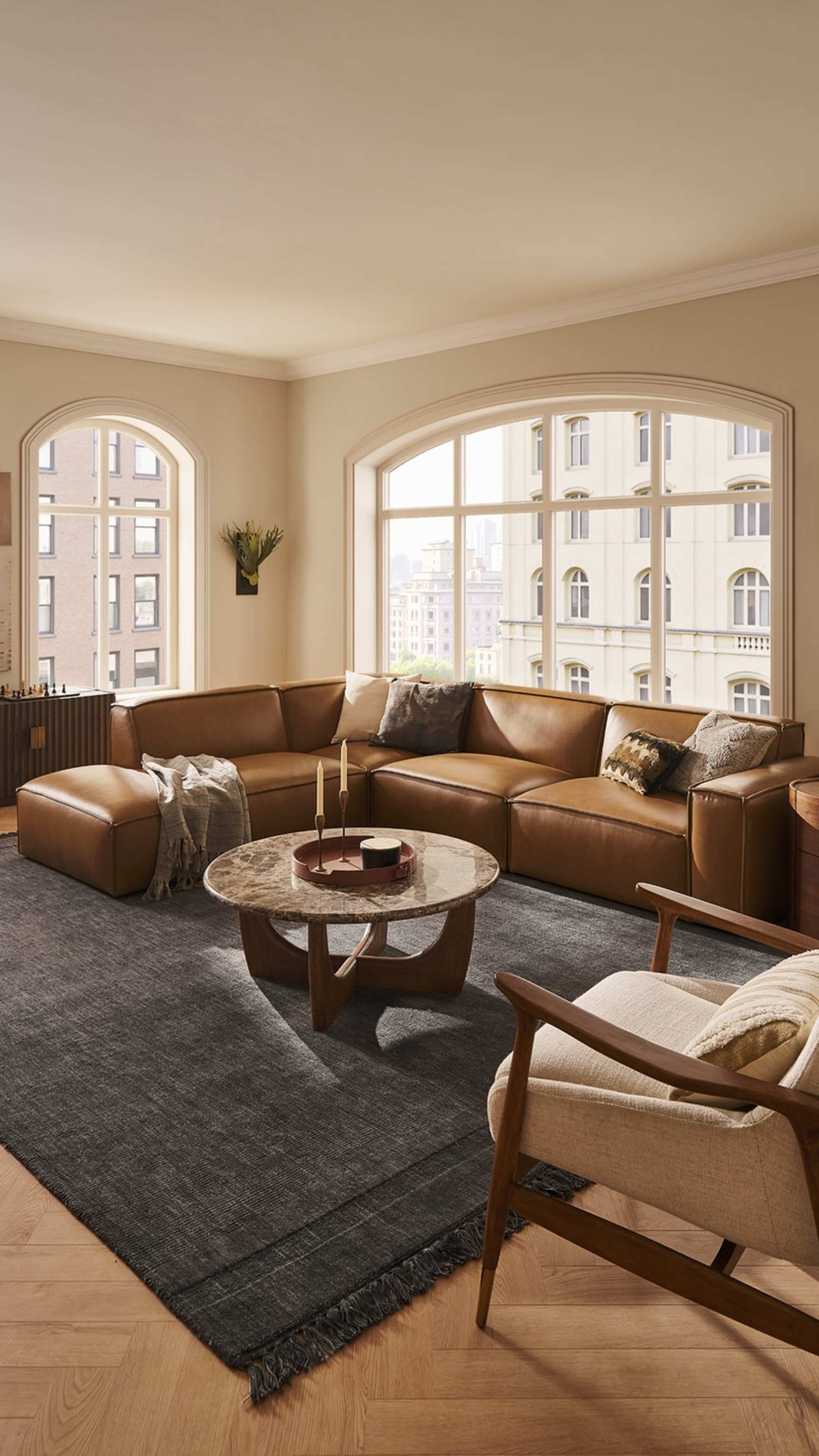 A leather extended side chaise corner sofa placed in a living room.