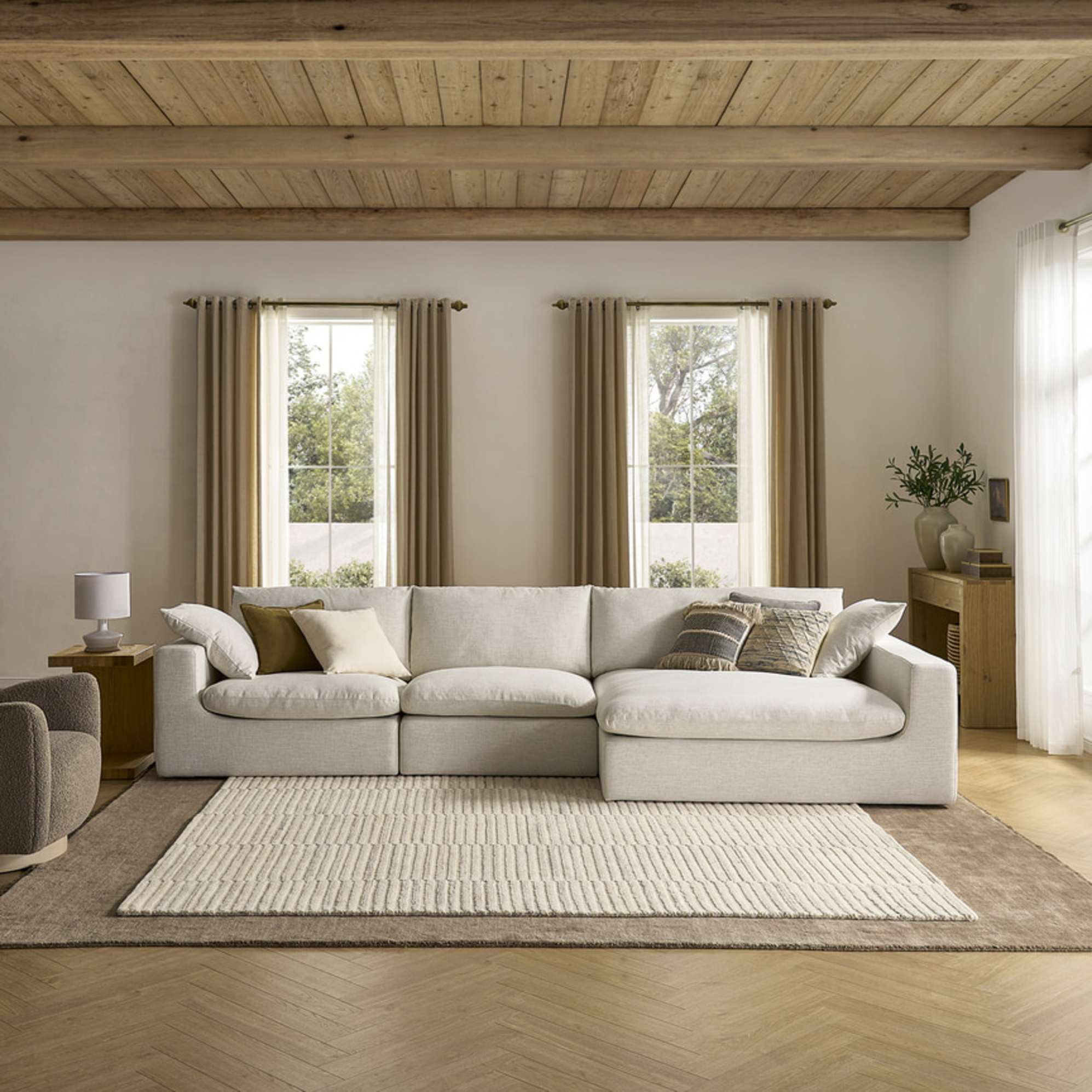 A wide chaise sectional sofa placed in a living room.