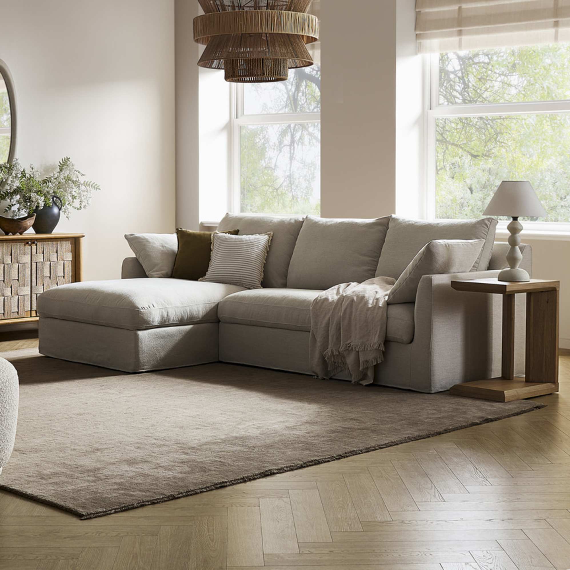 A left-chaise sectional sofa with slipcovers.