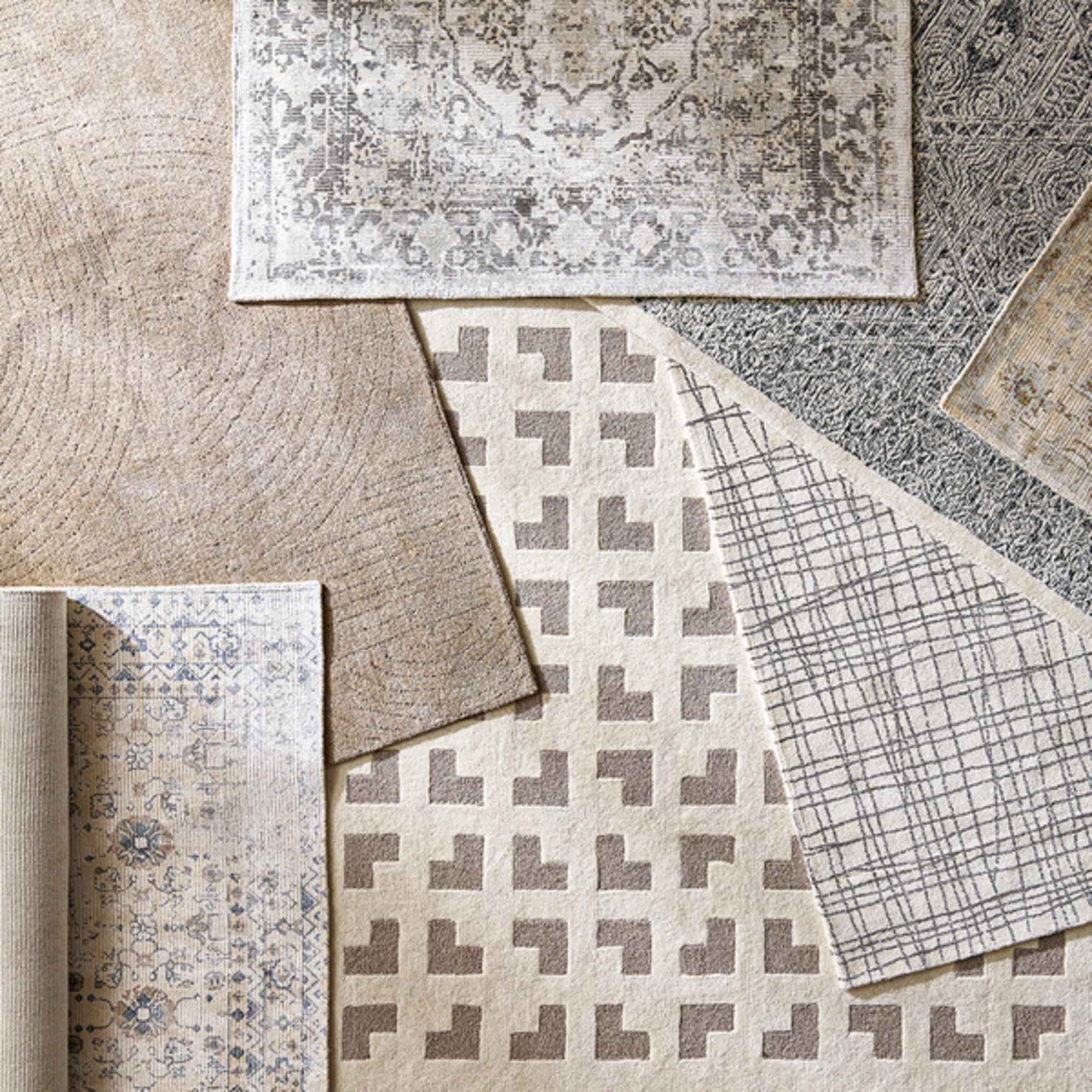 A pile of rugs placed atop each other.