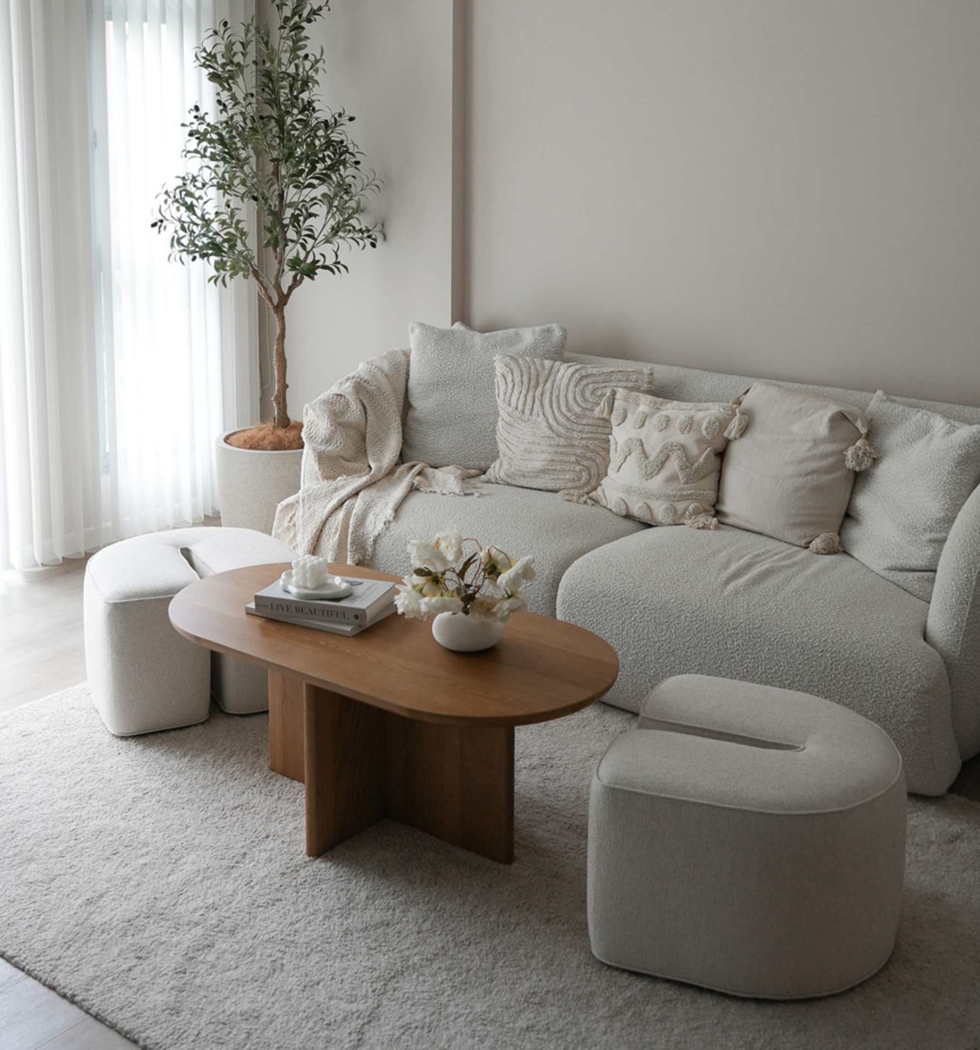 A rectangular nesting coffee table with its stools pulled out.