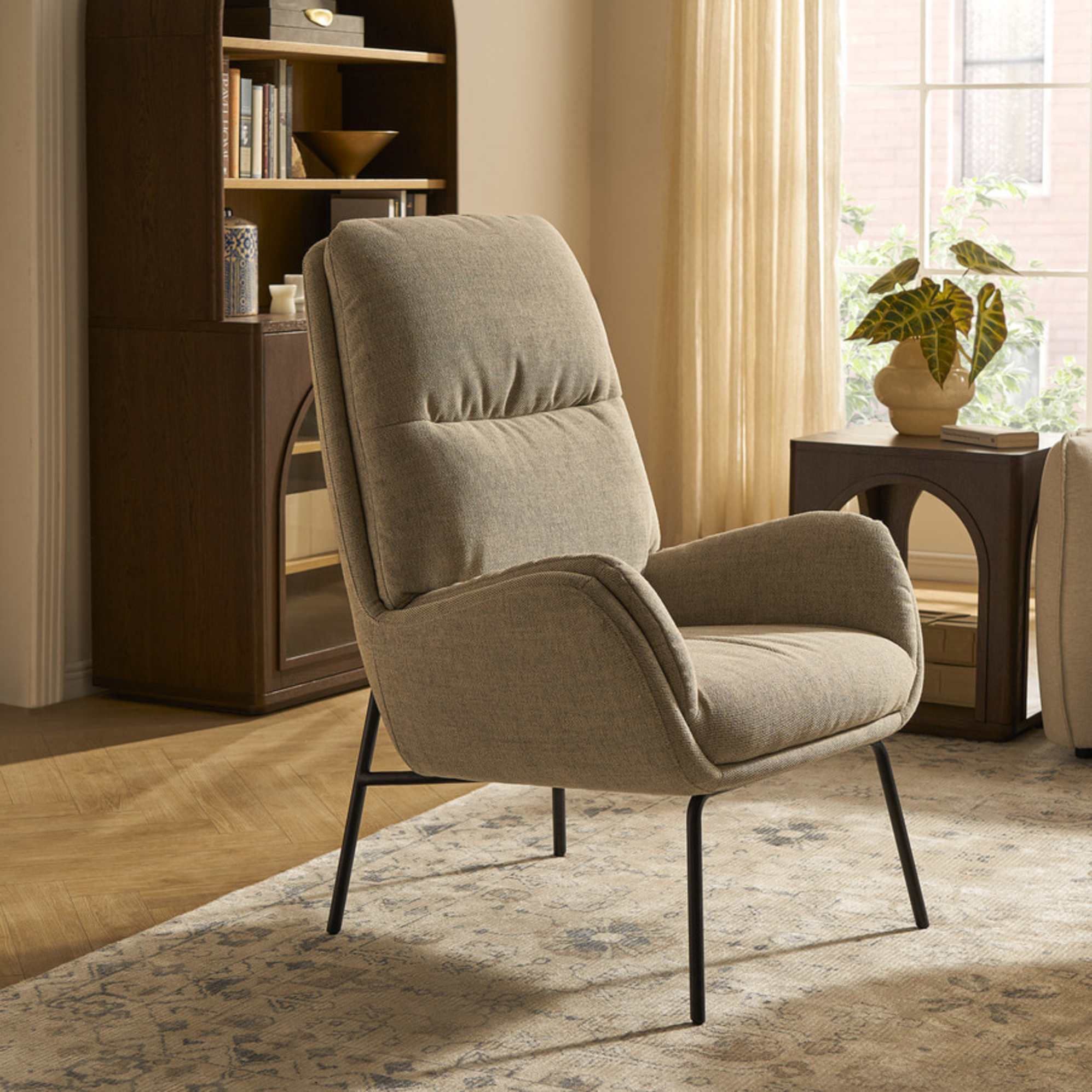 A performance fabric armchair placed on a gray area rug.