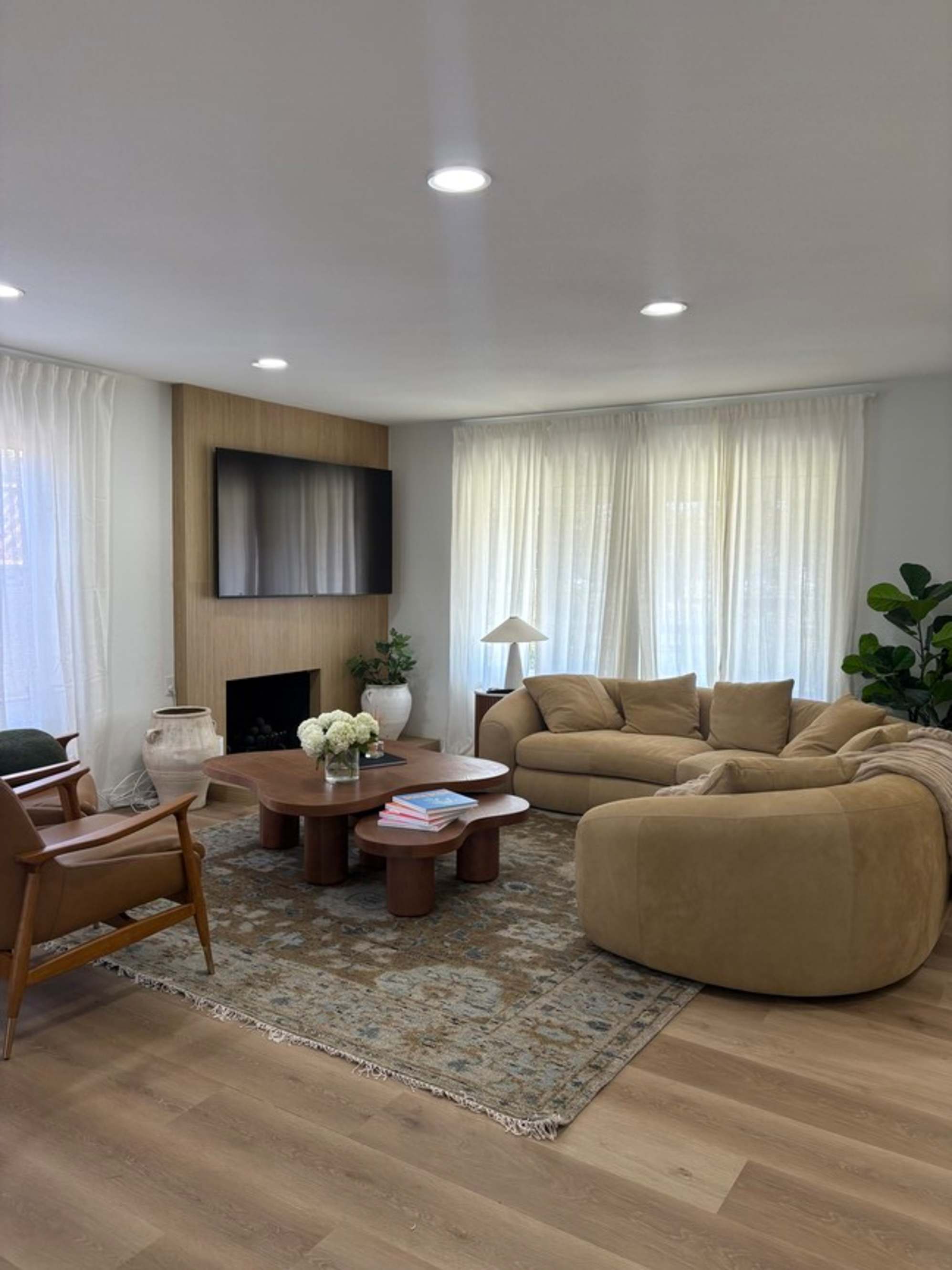 A nubuck leather sectional sofa placed in a living room.