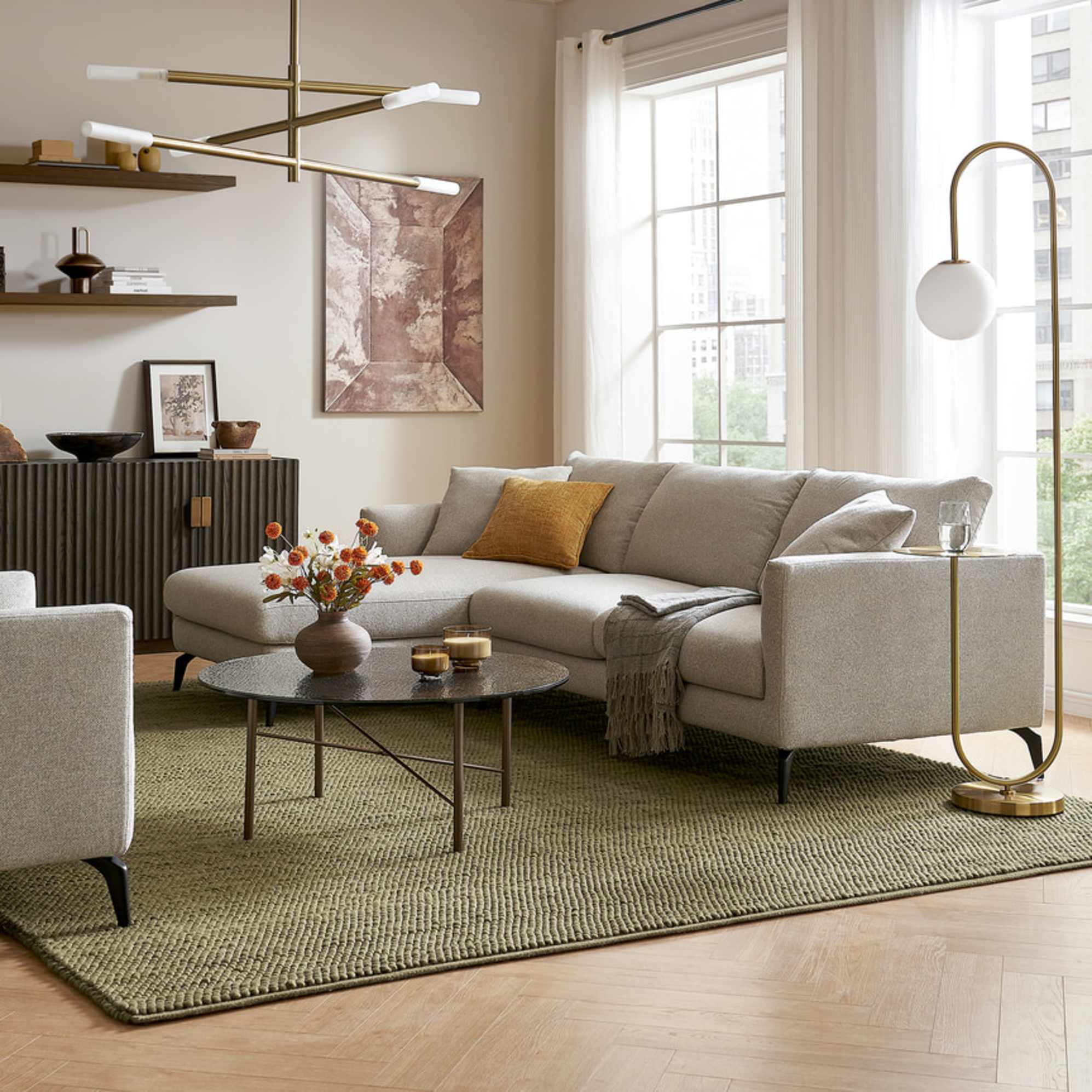 A left-facing chaise sectional sofa with a glass coffee table.