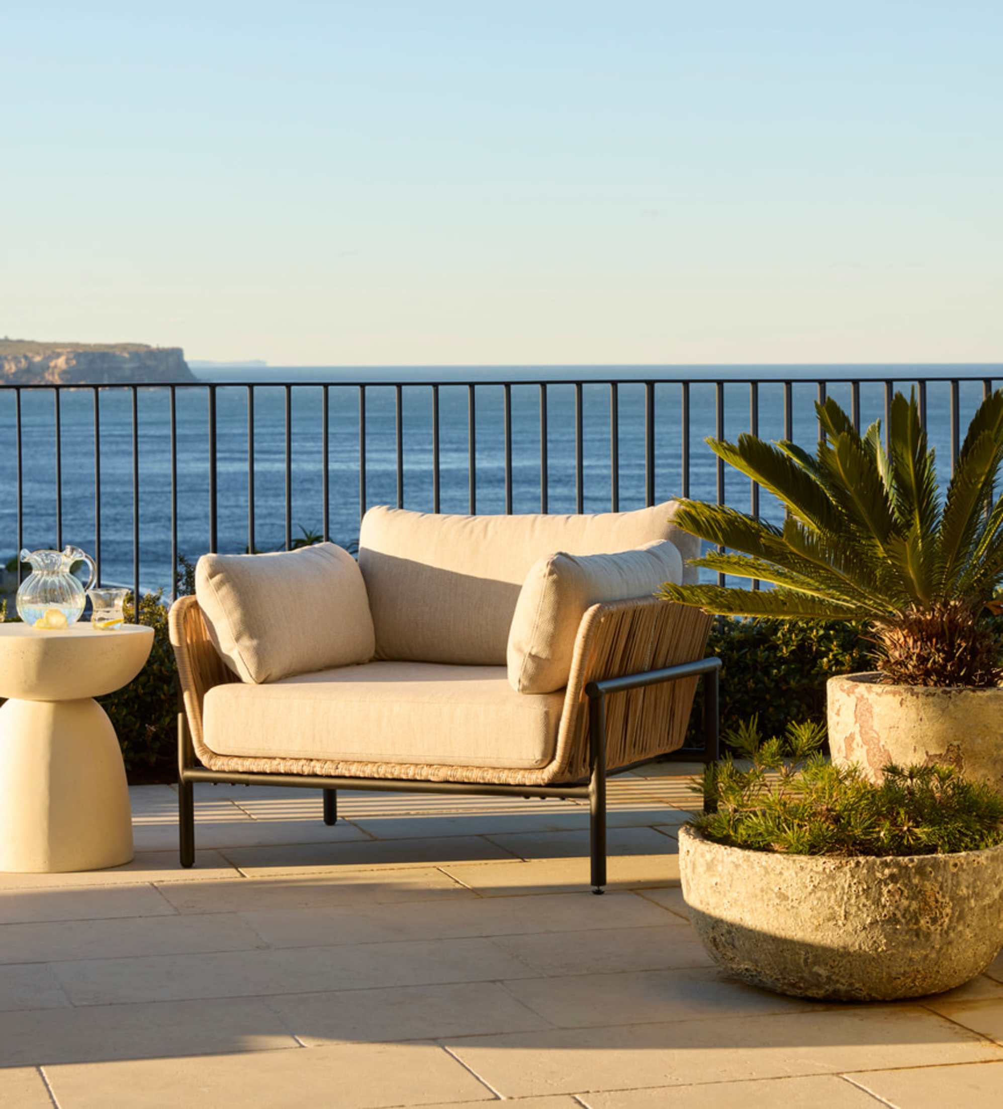 An outdoor lounge chair bathed in the sun’s rays.