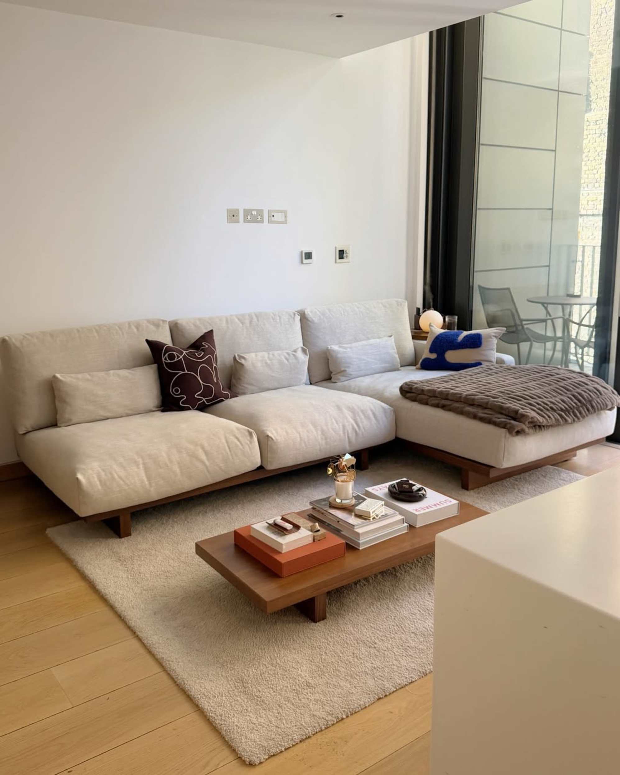 A performance fabric chaise sectional sofa placed against a wall in a living room.