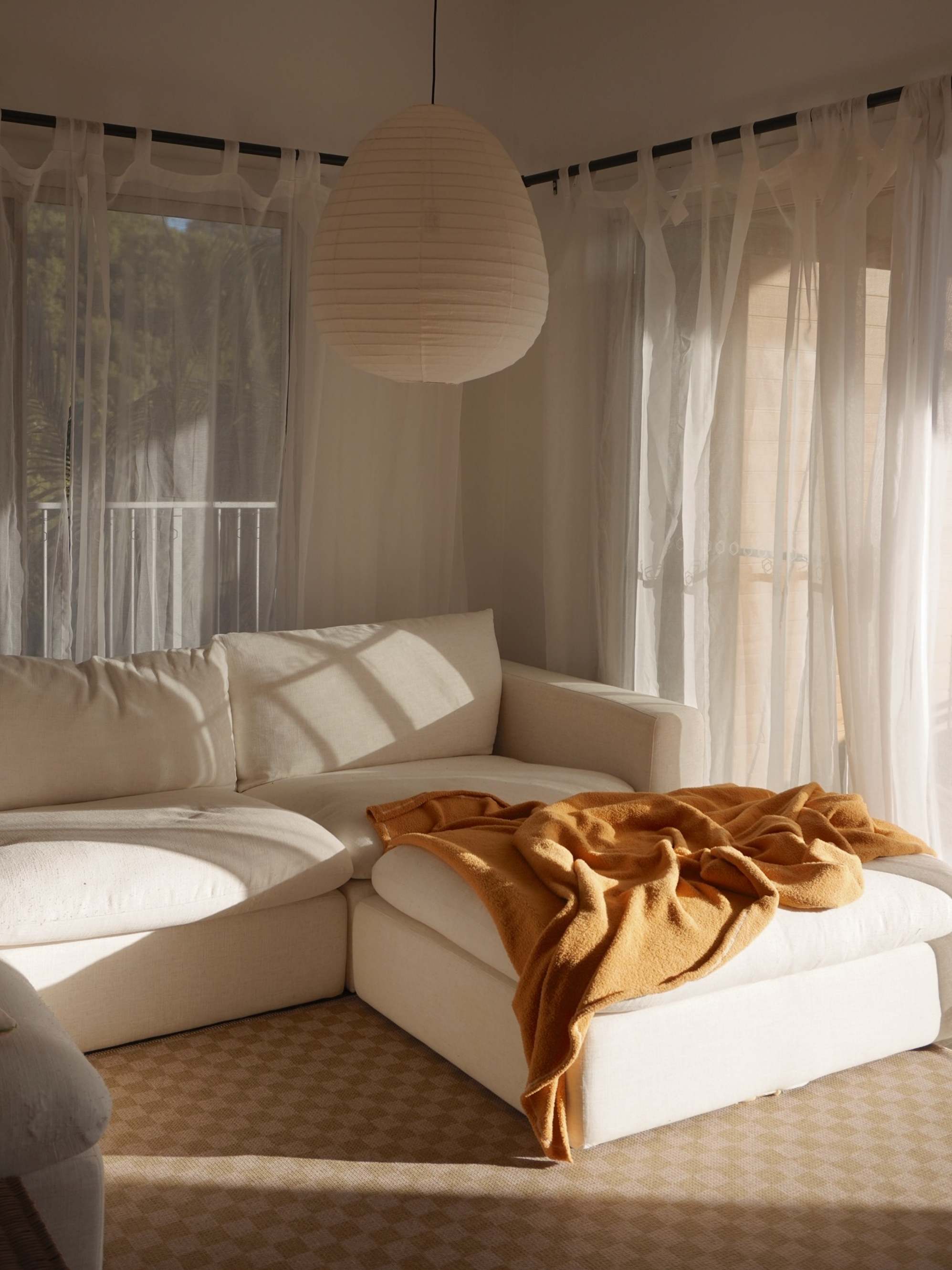 White sofa in living room with natural sunlight