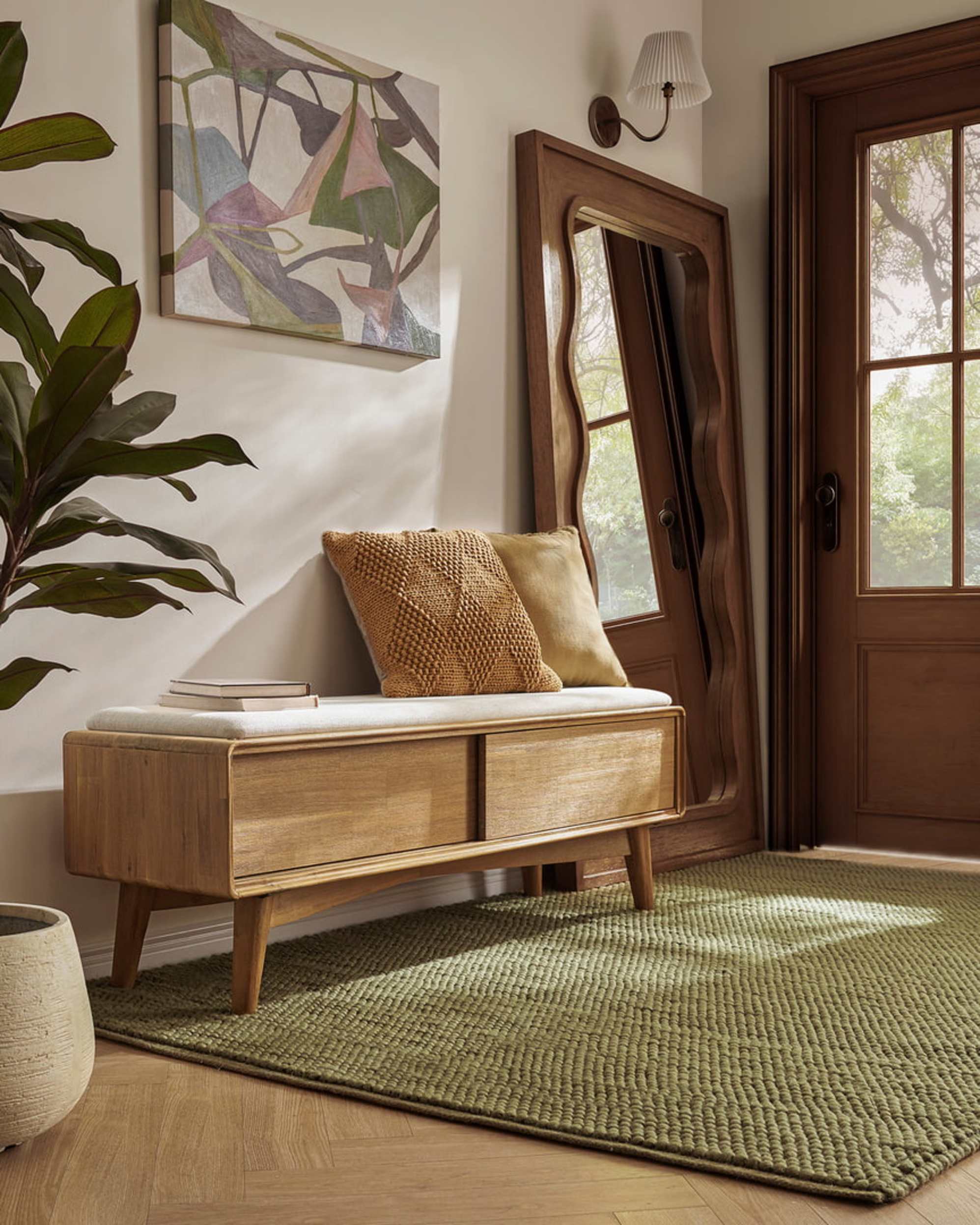 A wooden bench with hidden storage and two books placed on top.
