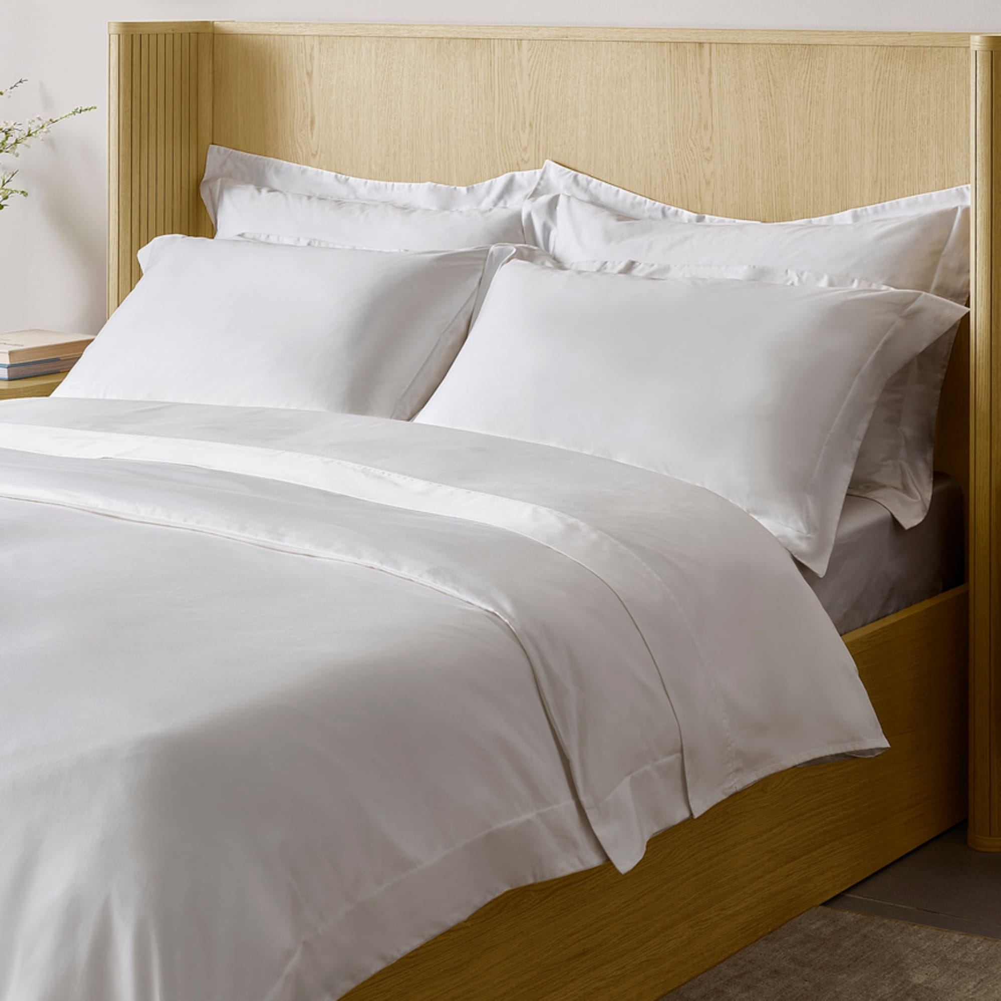 An Egyptian cotton bedsheet with matching pillowcases.