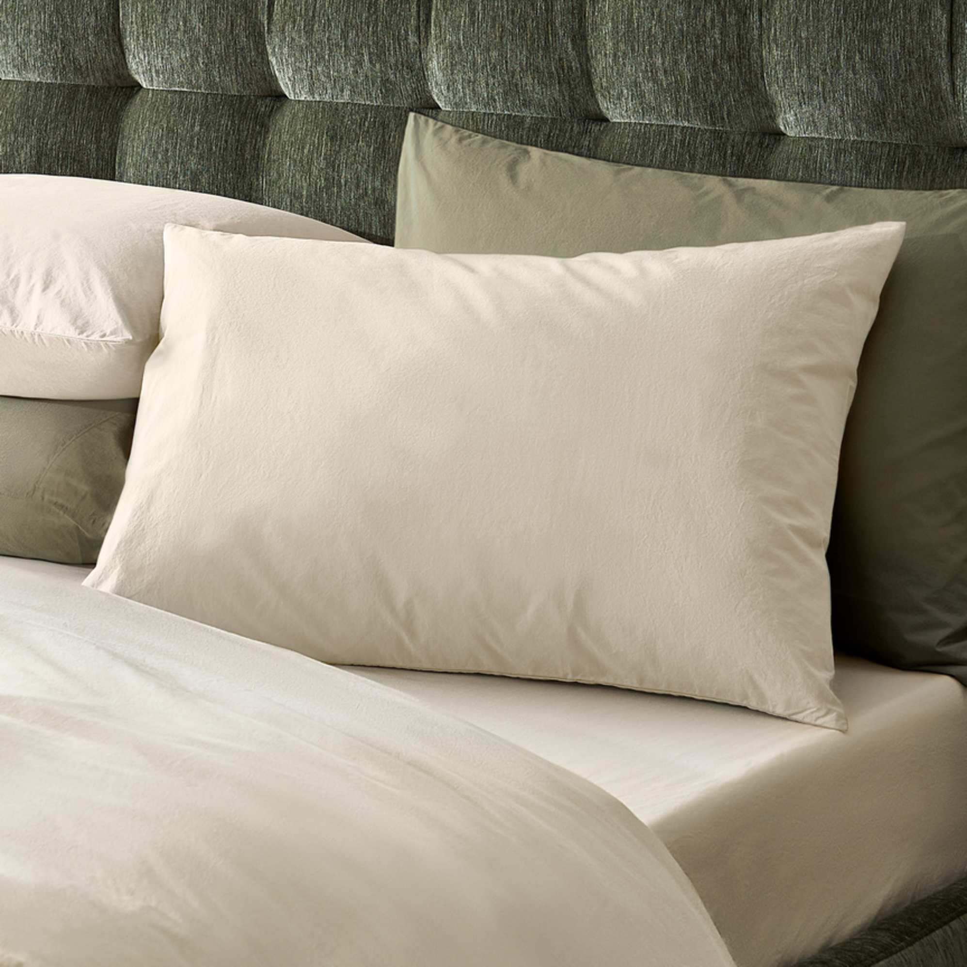 A wheat-colored cotton percale pillowcase.