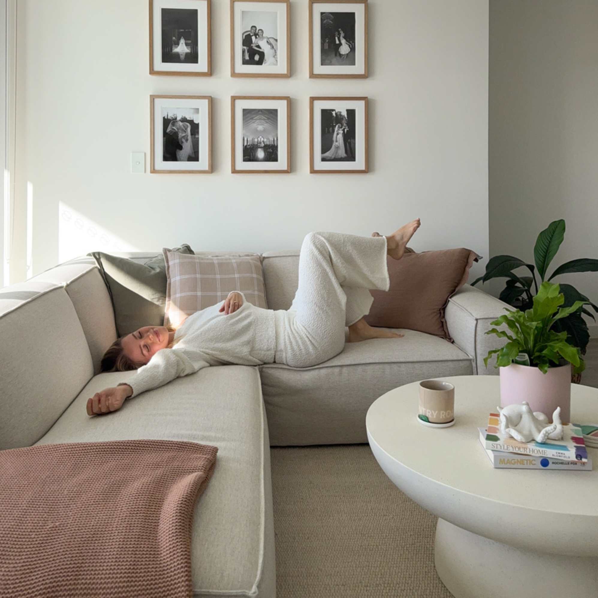 A person lying down on a performance fabric side chaise sectional sofa.