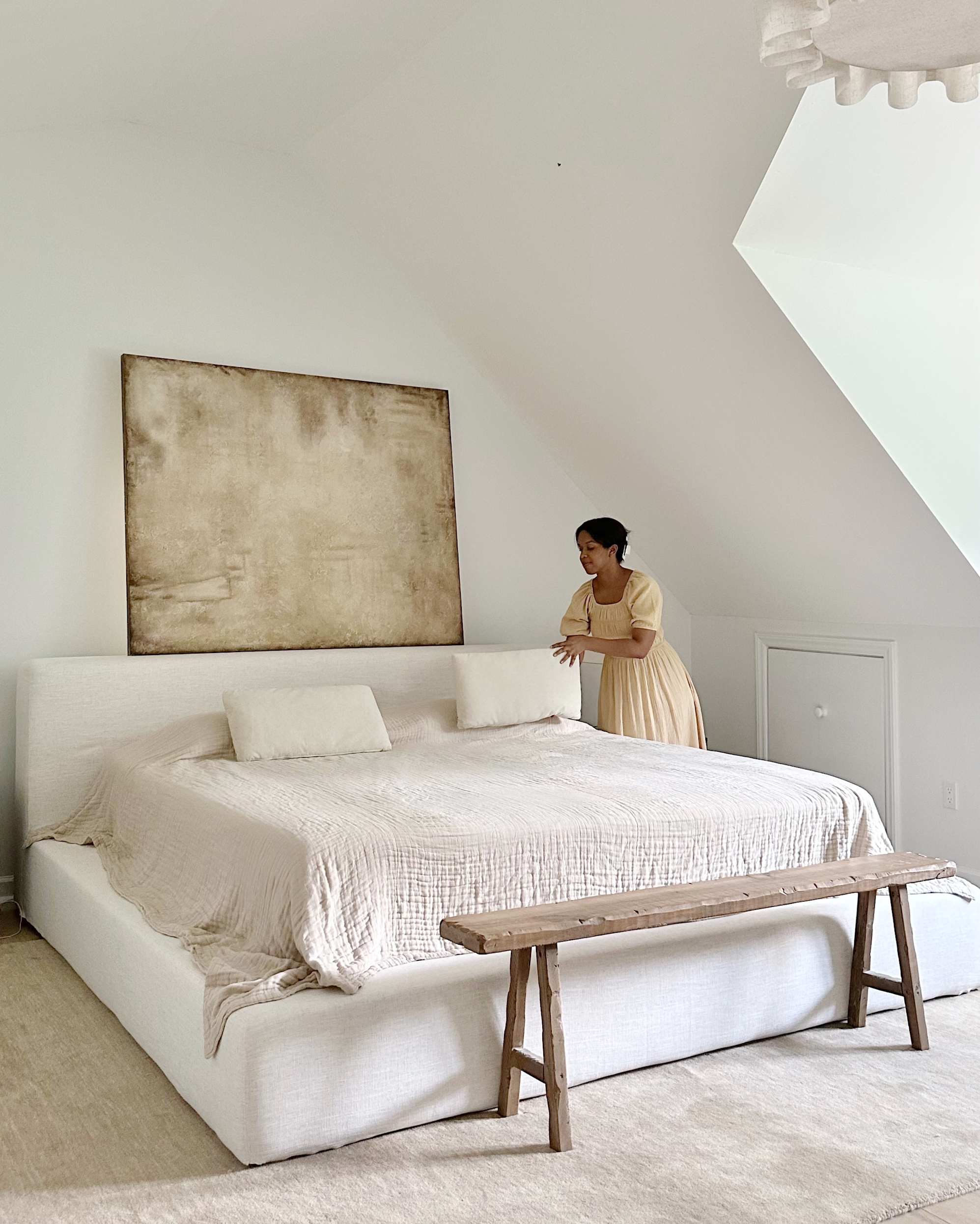 A white upholstered storage bed