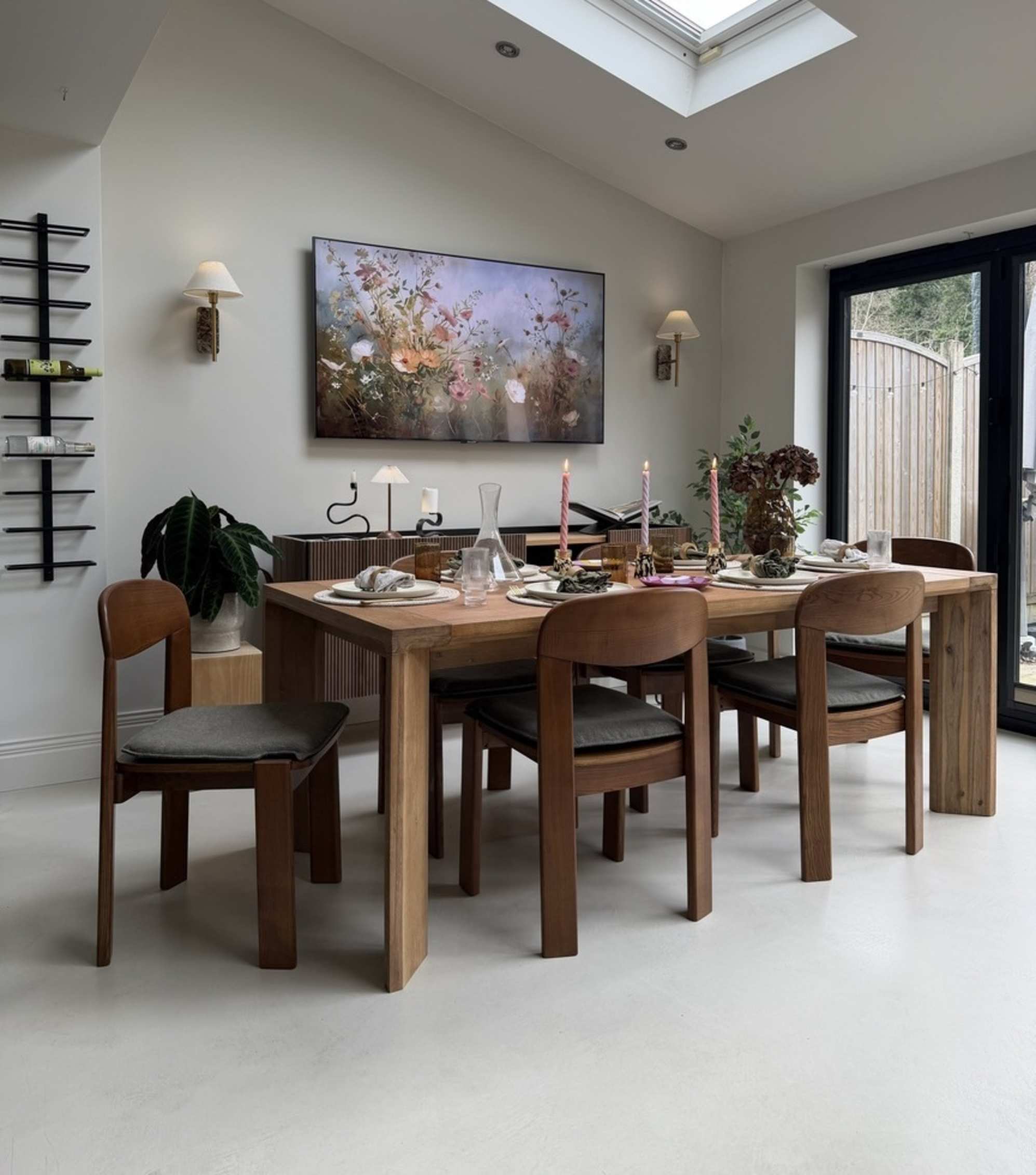 A wooden dining table with wooden dining chairs.