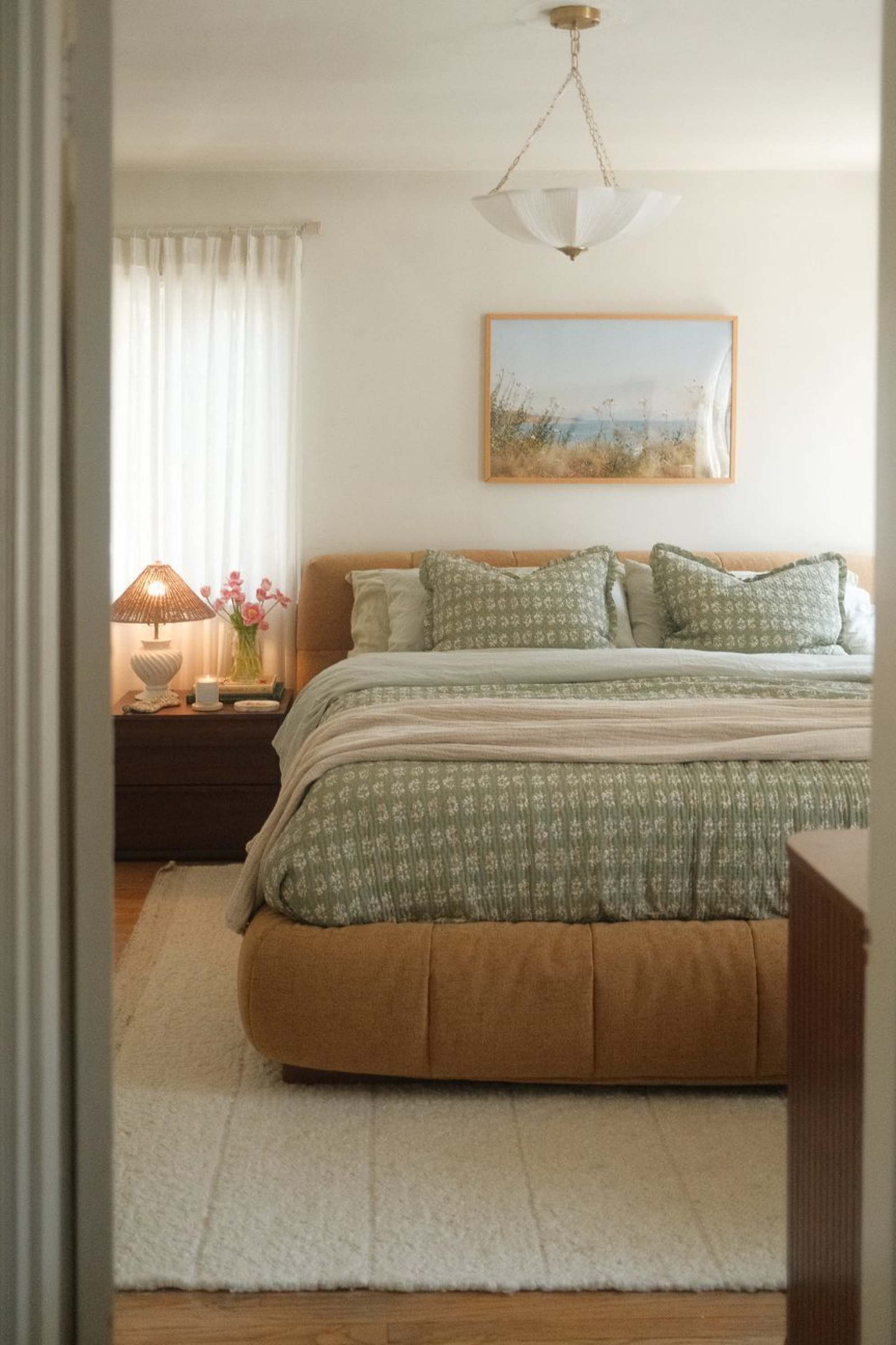 A mustard yellow storage bed placed in a bedroom.