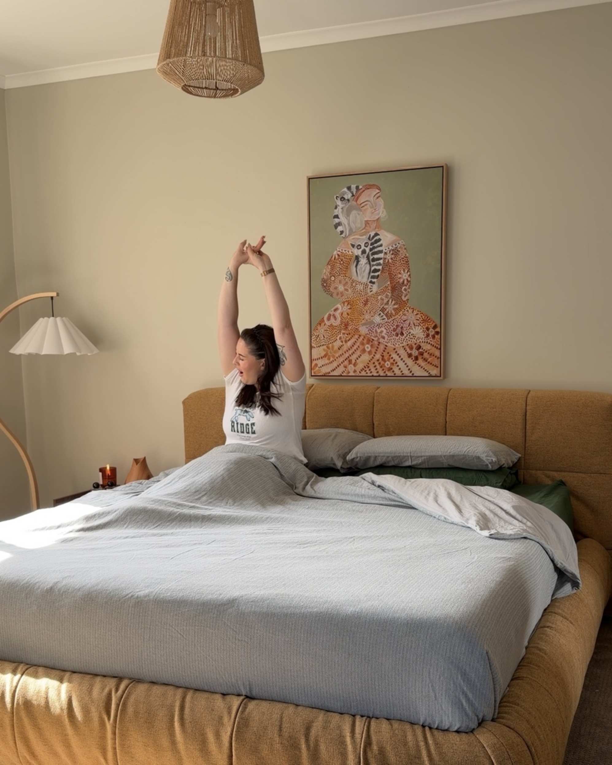 A mustard yellow storage bed placed in a bedroom.