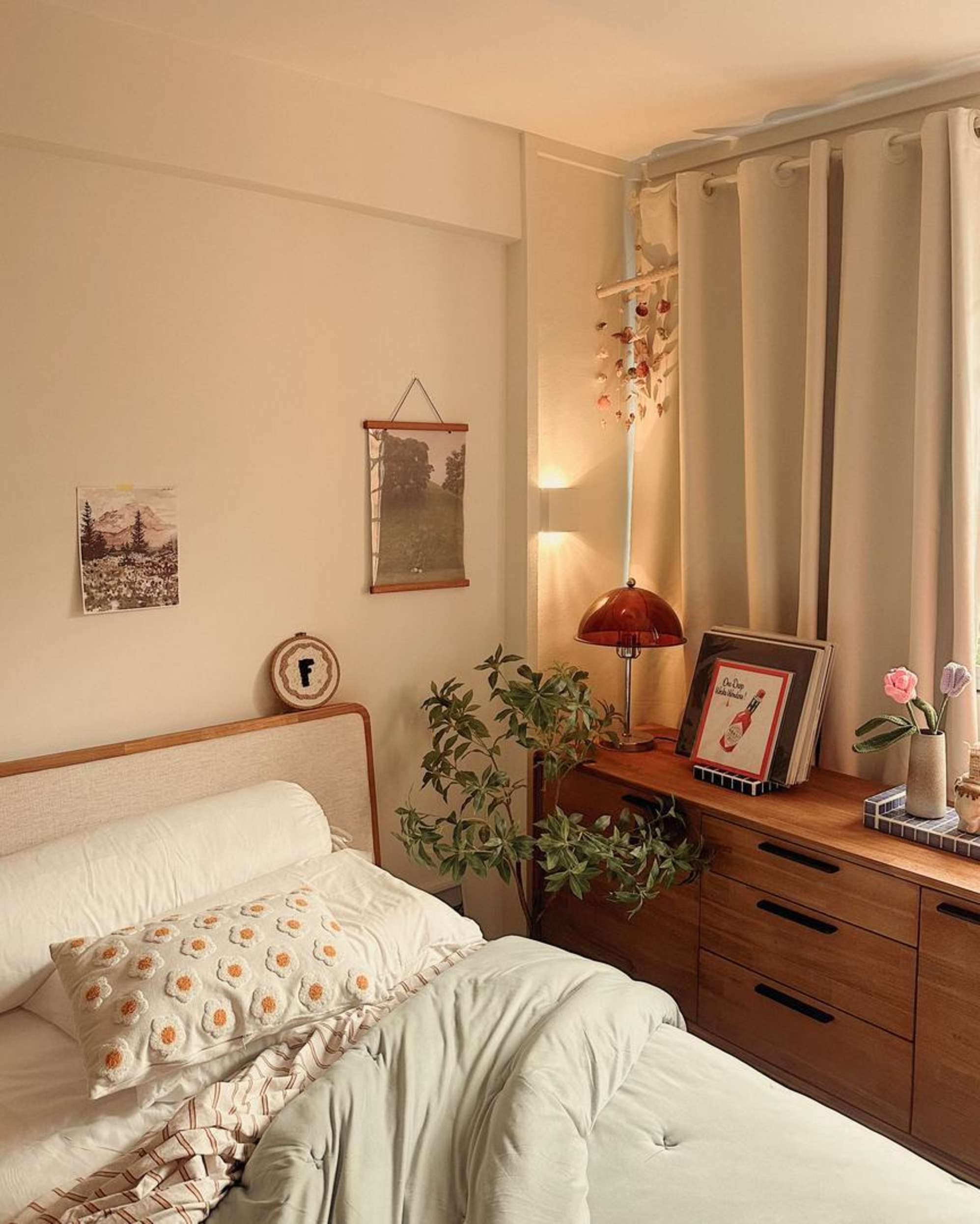 A wooden bed with a matching sideboard placed beside it.