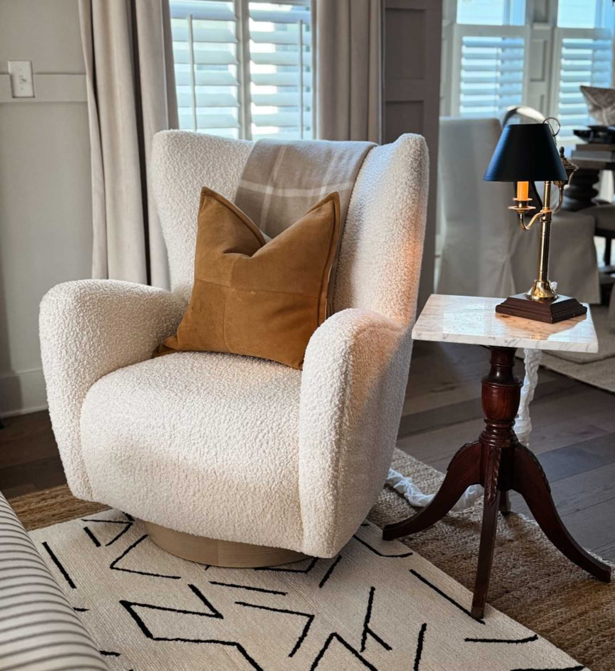 A wingback armchair placed beside a side table in the living room