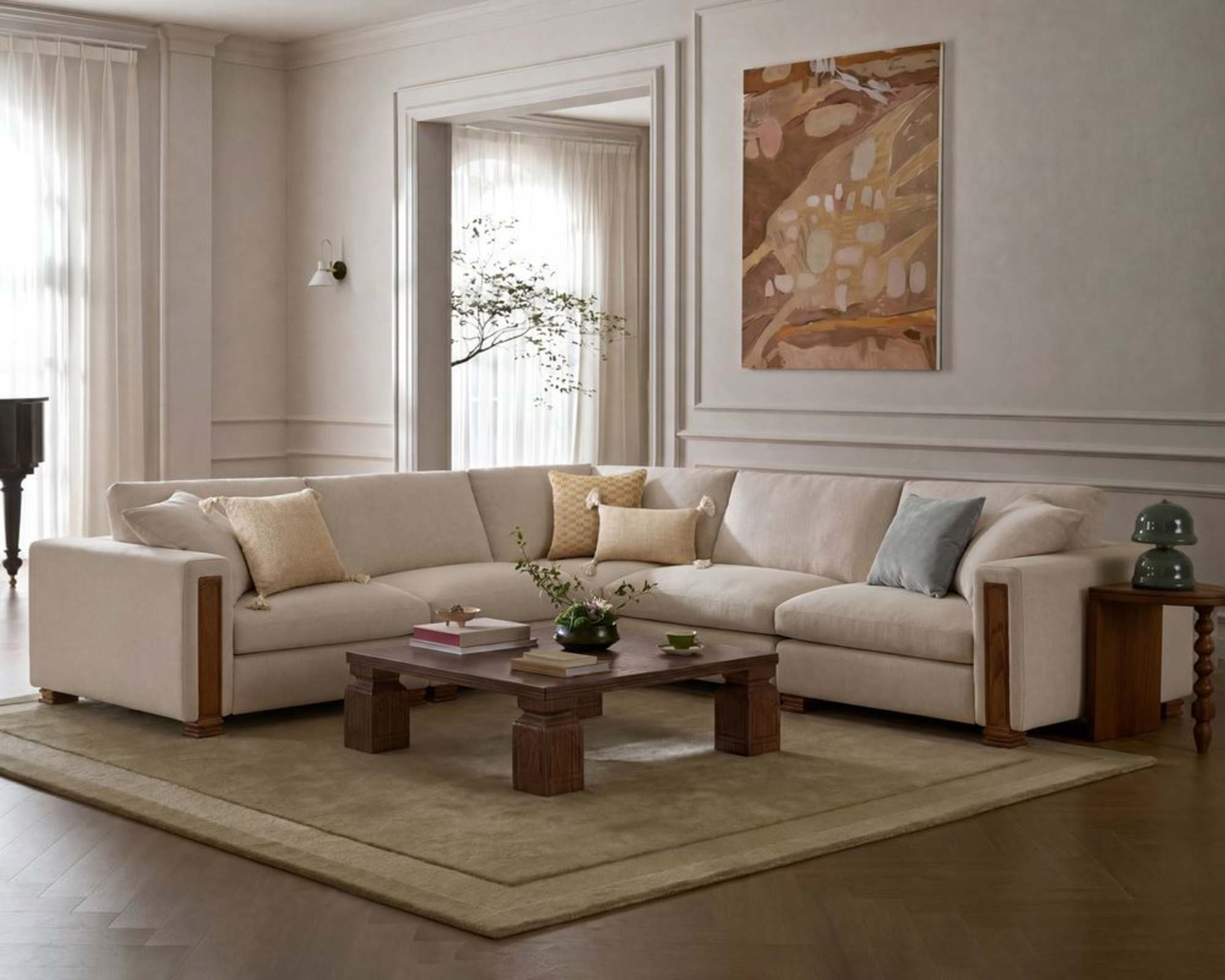 A large sofa with an area rug placed beneath.