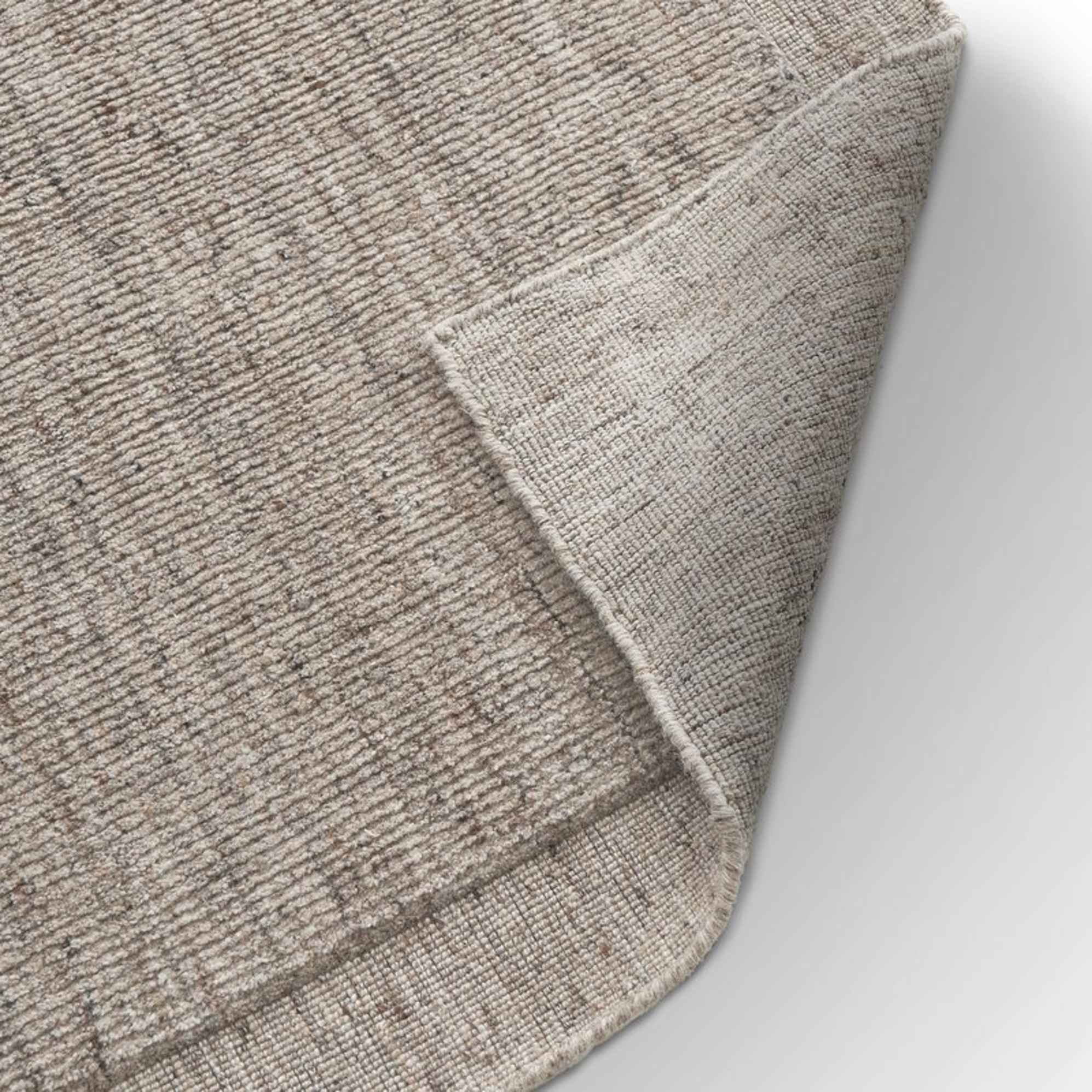 A performance rug in a gray tone.