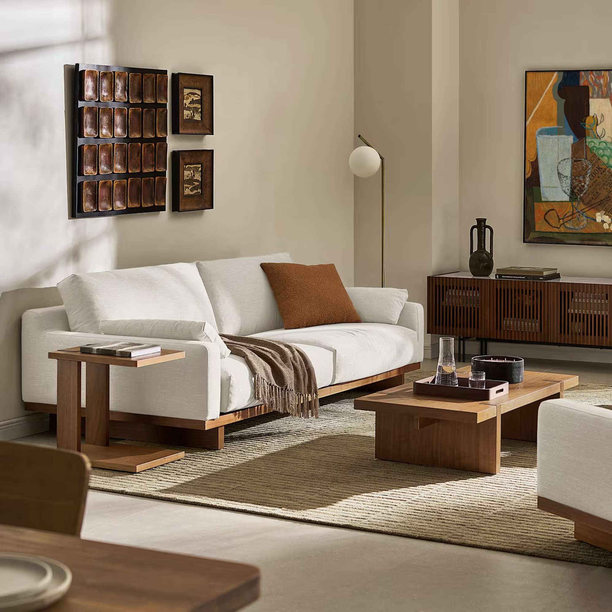 A performance fabric 2-seater sofa placed against a wall in a living room.
