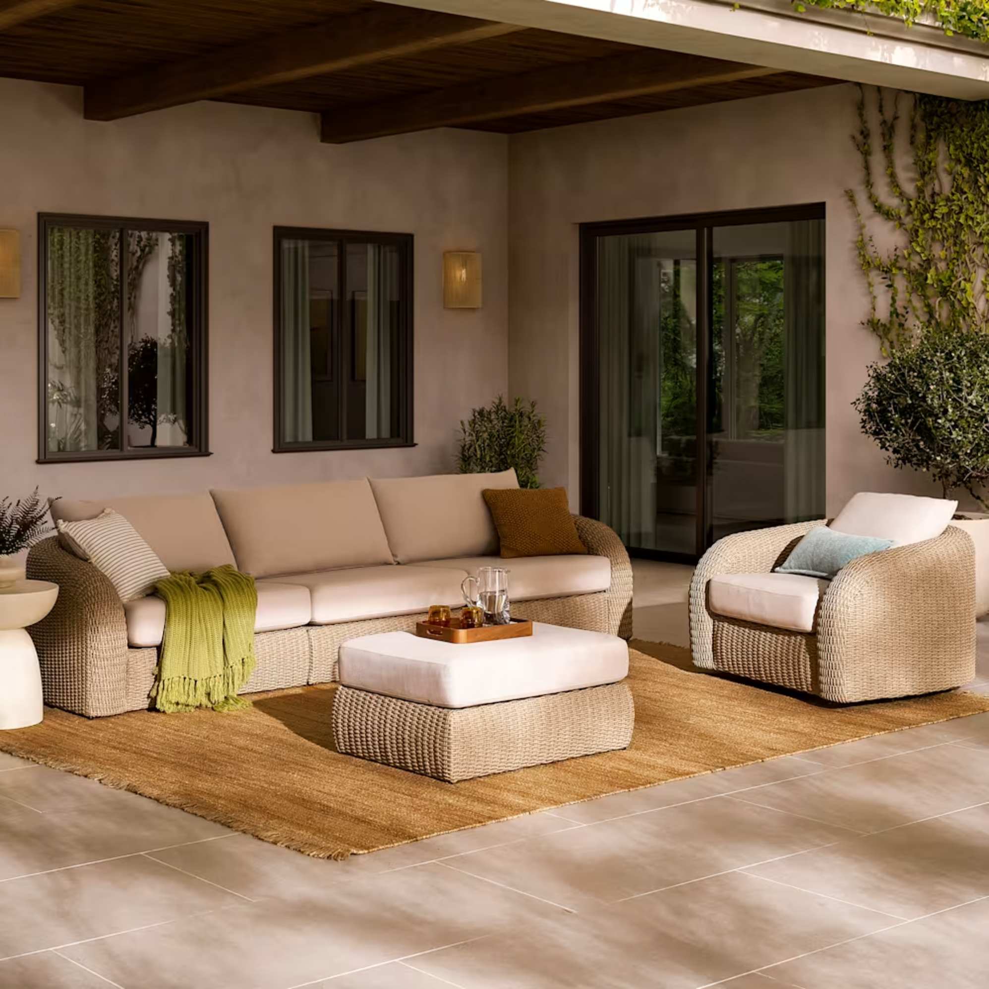 An extended outdoor 3-seater sofa with a swivel chair.