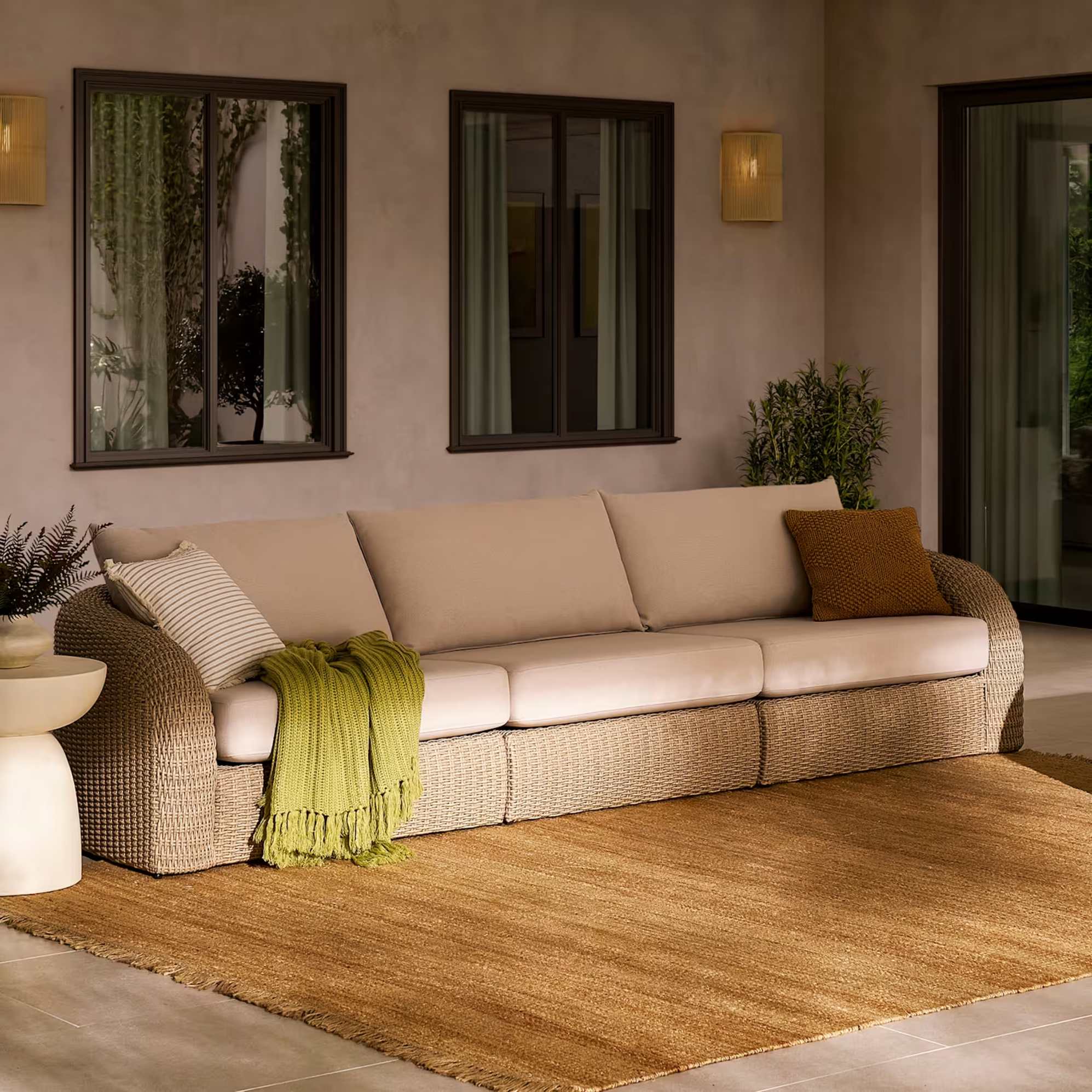 An extended outdoor 3-seater sofa.