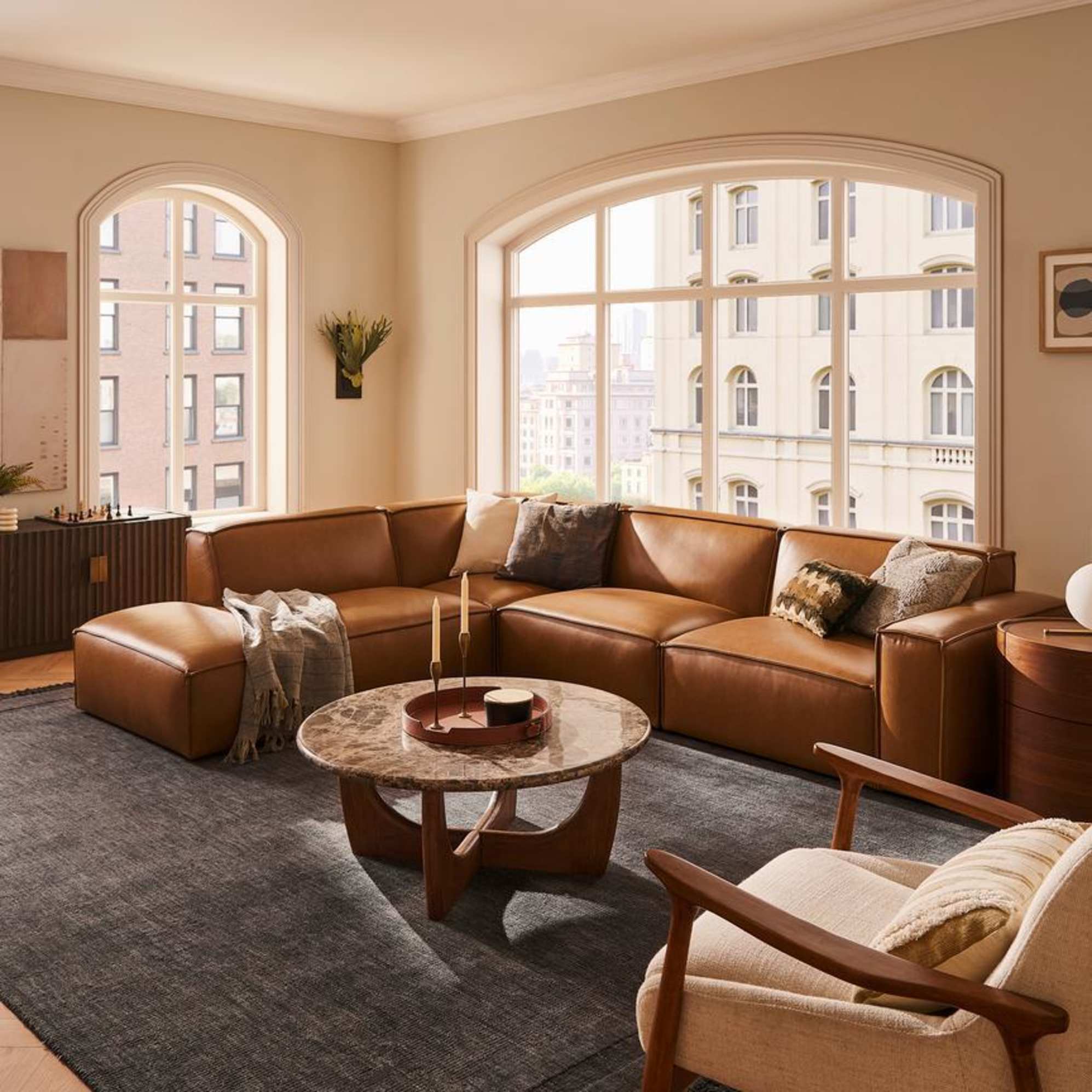 An leather extended side chaise sectional sofa placed in a living room.