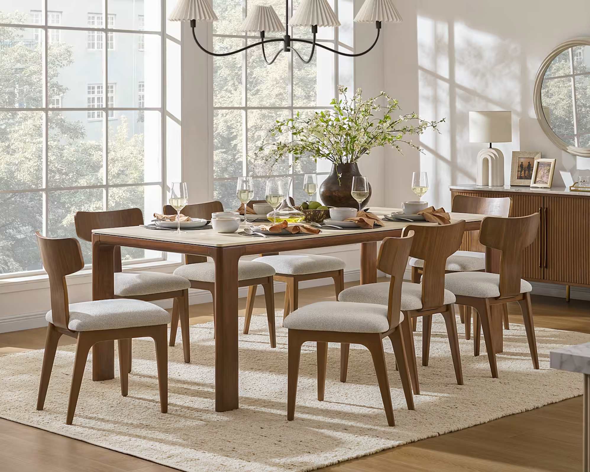 A sintered stone table with eight dining chairs.