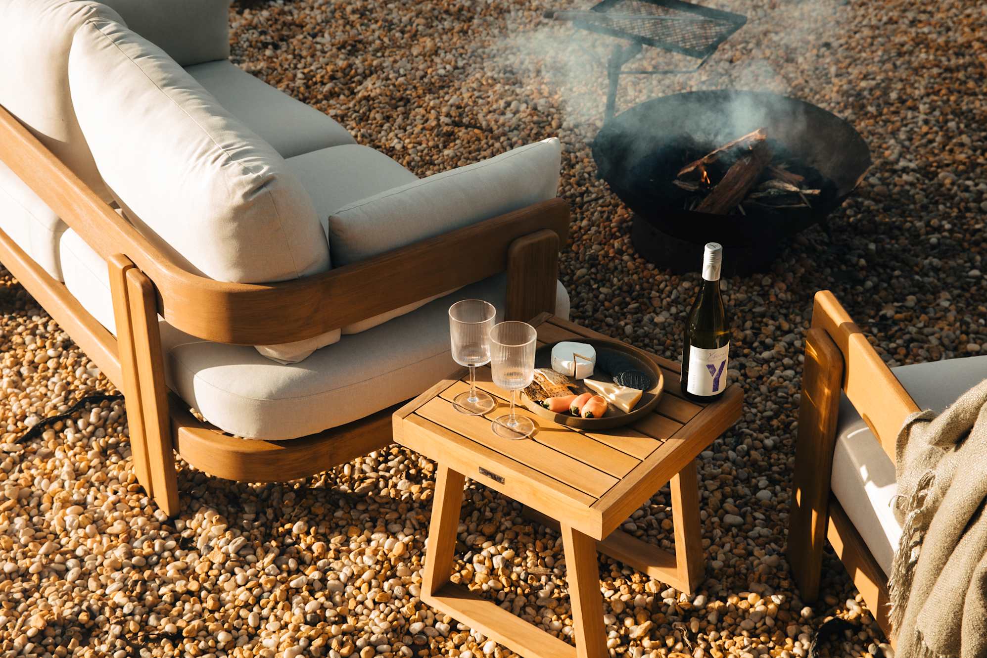 Eden Outdoor Sofa Set by a firepit