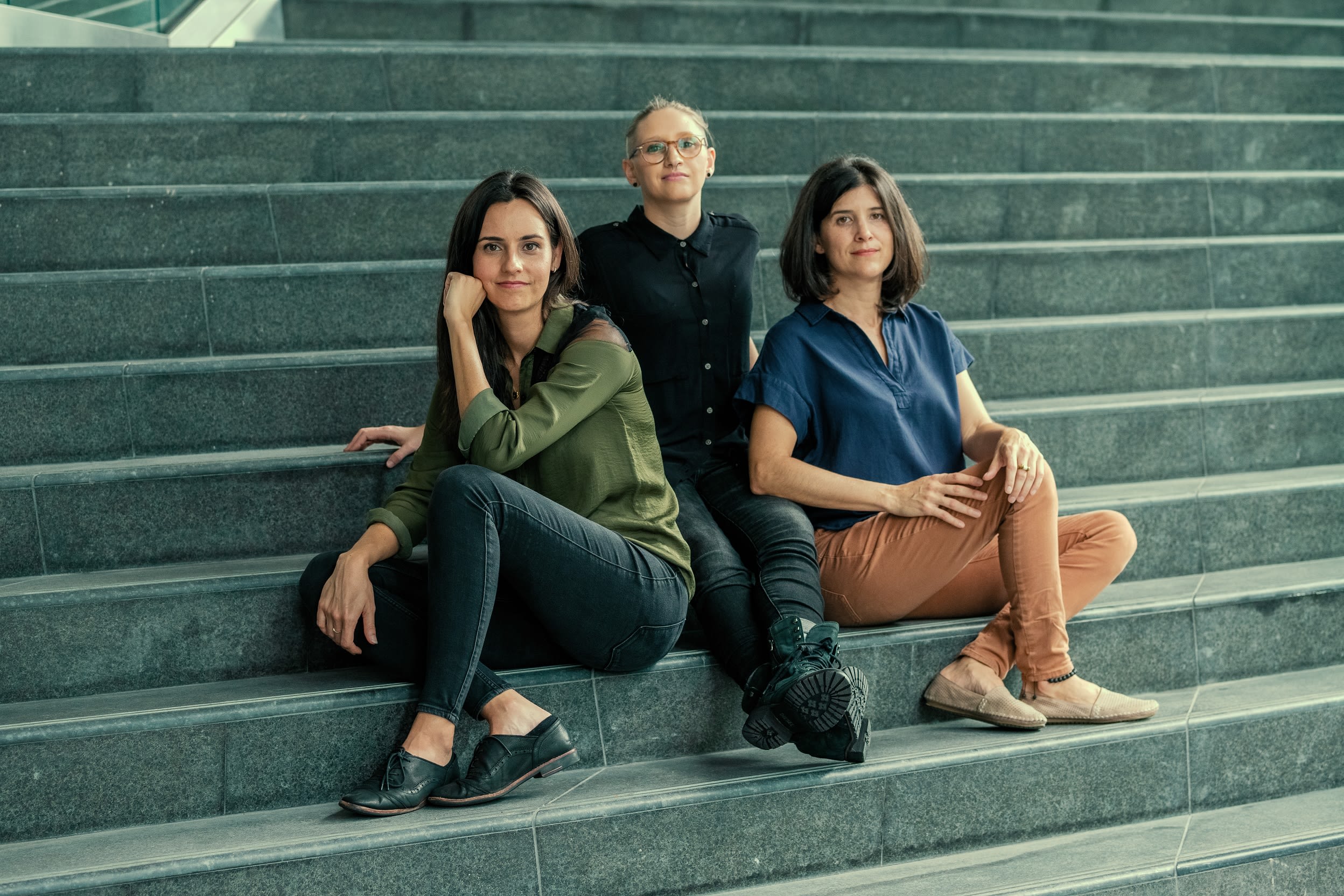L to R: Caara, Jessica and Ilyana sitting on a staircase