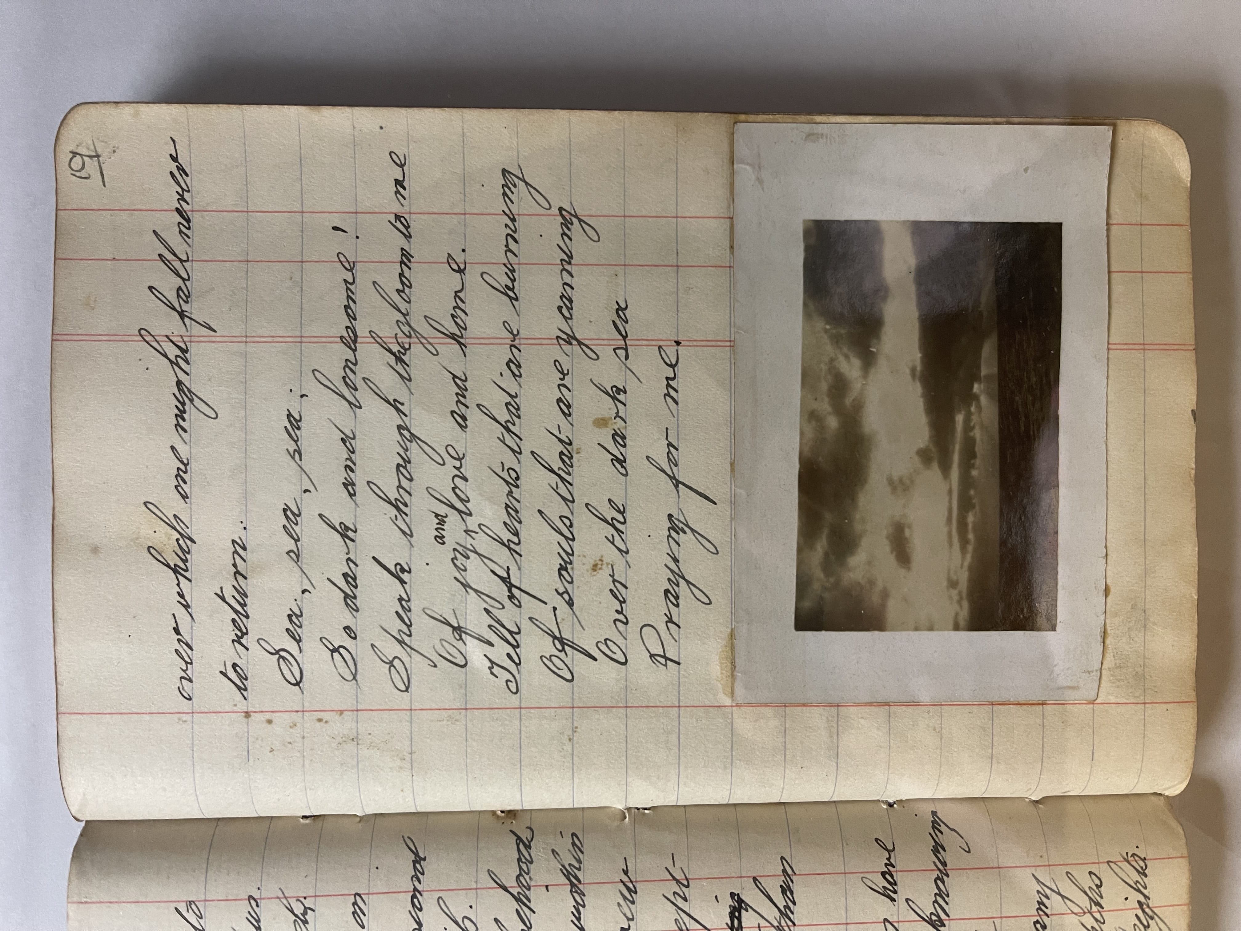 photo of page 19, transcribed above. Includes a small black and white photo of shafts of light through scattered clouds, over a calm sea