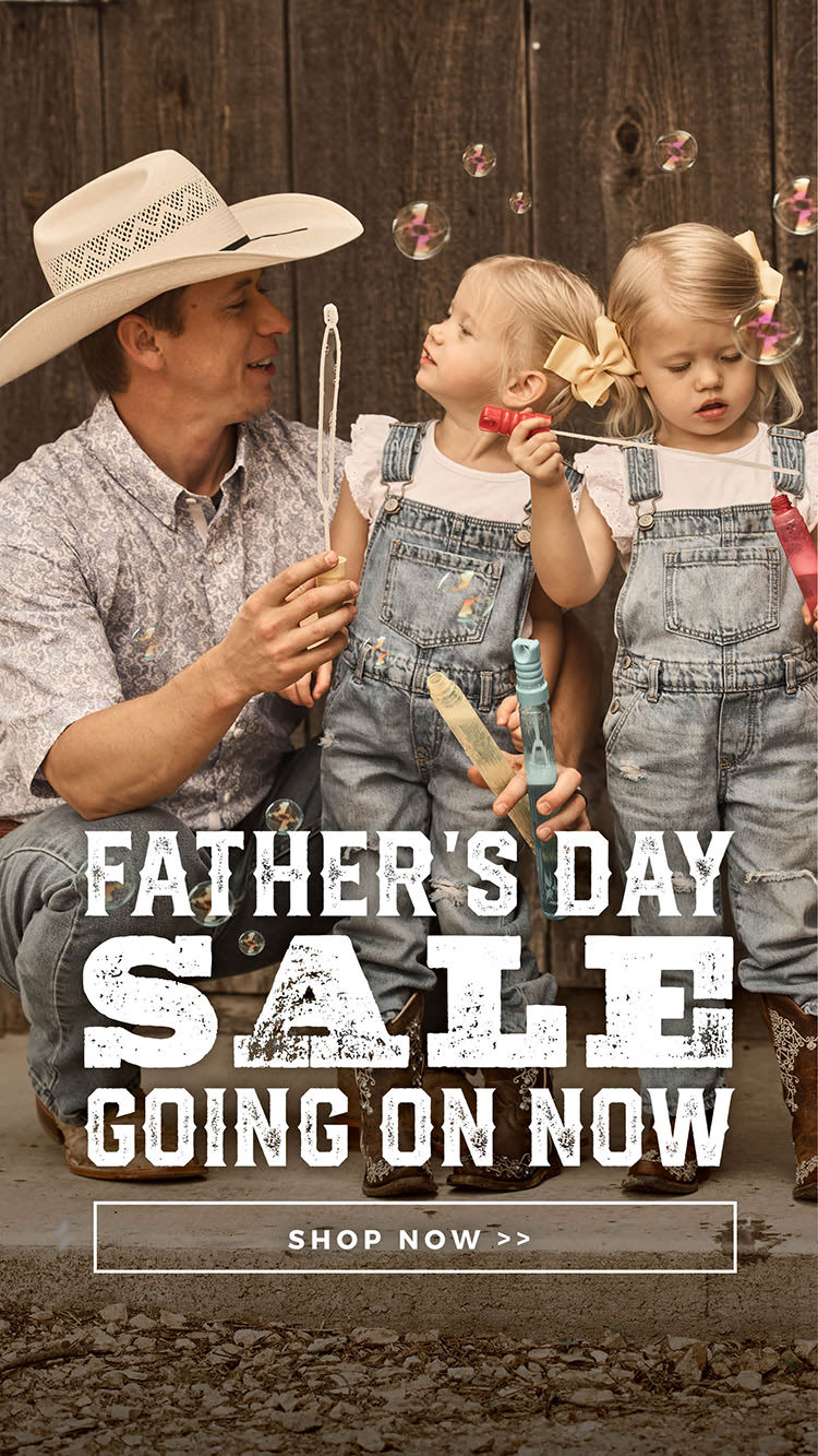 Banner picturing a cowboy blowing bubbles with his 2 daughters. Text in the lower section of the image reads "FATHER'S DAY SALE GOING ON NOW" in textured white letters. Click to shop the sale