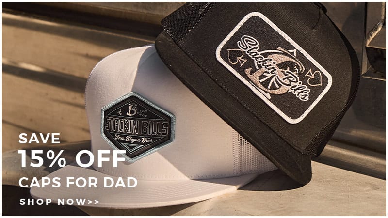 An image showing 2 caps stacked on top of one another on a bench with white text reading "SAVE 15% OFF CAPS FOR DAD". Click to shop.