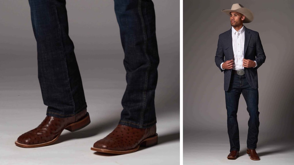 A side-by-side image displaying a man's western-inspired outfit. On the left, a close-up of his legs shows dark denim jeans and brown ostrich leather cowboy boots. On the right, the full outfit is revealed, featuring the man standing confidently in the same jeans and boots, complemented by a crisp white shirt, a tailored sports coat in a dark weave, a large silver belt buckle, and a light-colored cowboy hat. His posture and attire convey a polished, modern cowboy look.