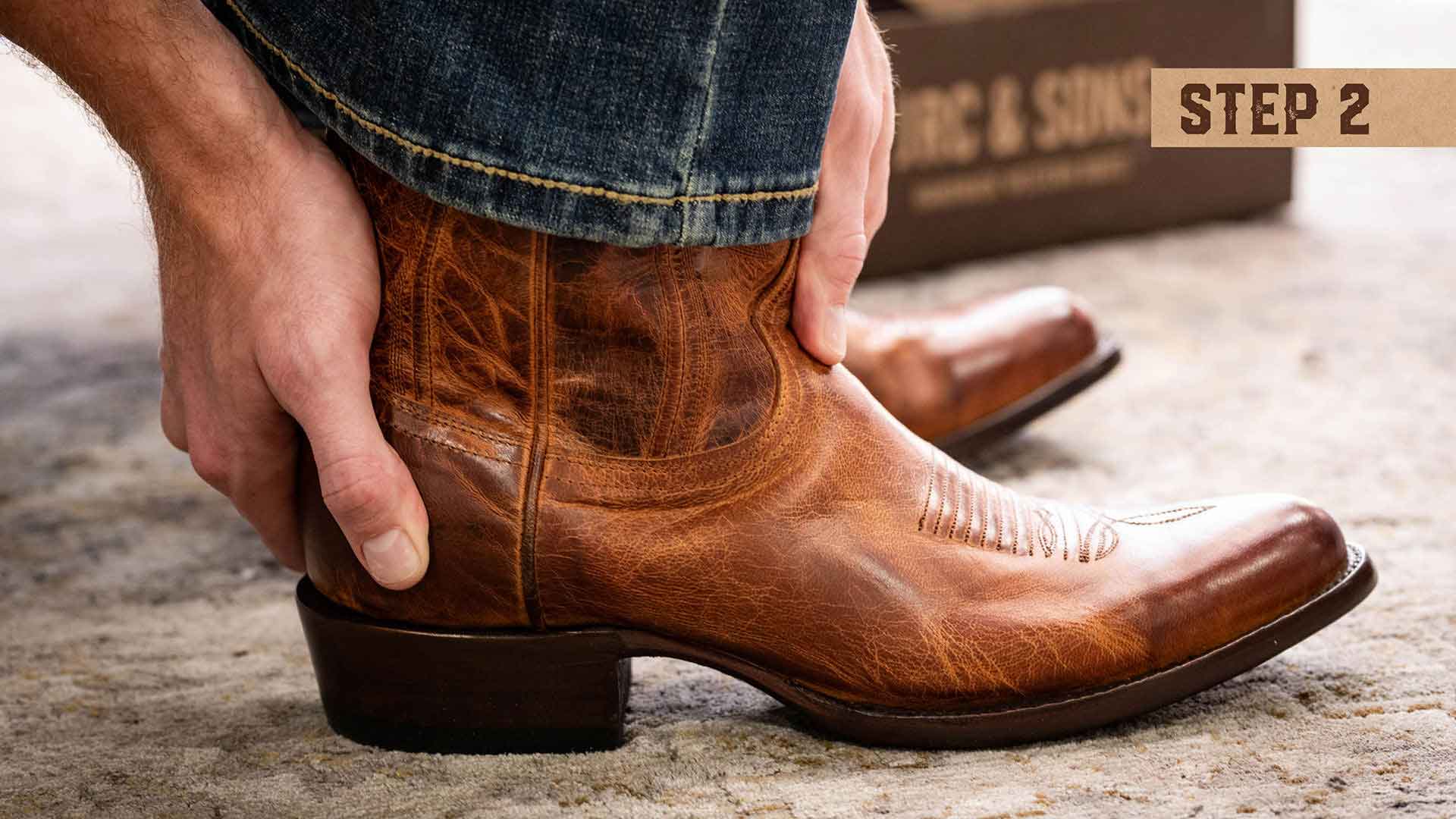 Step two of fitting a cowboy boot: Checking your heel height. Ensure the boot's heel fits snugly against your foot, providing support and stability.