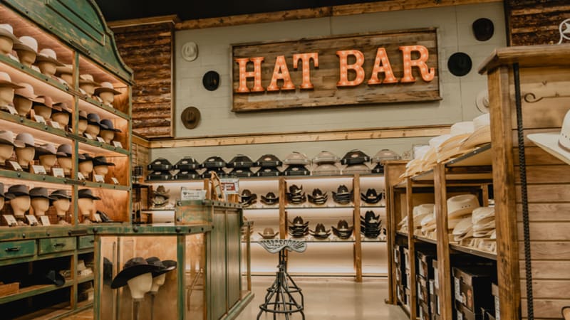 A diverse collection of cowboy hats displayed at Cavender's, showcasing various styles and materials.