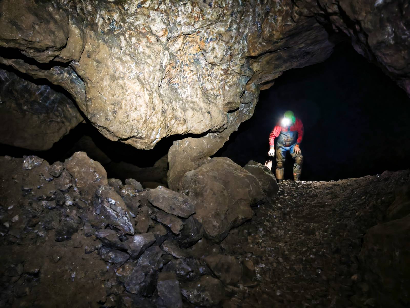 Historic mine tunnel with timber supports and rails