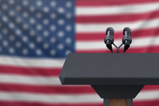 microphone on podium in front of American flag